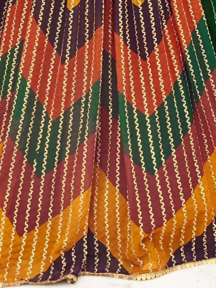 Colorful ethnic lehenga with geometric patterns and gold embroidery, perfect for Indian festive wear