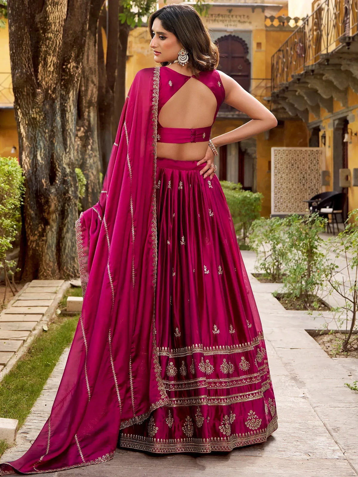 Elegant magenta lehenga choli with gold embroidery, perfect for Indian ethnic wear