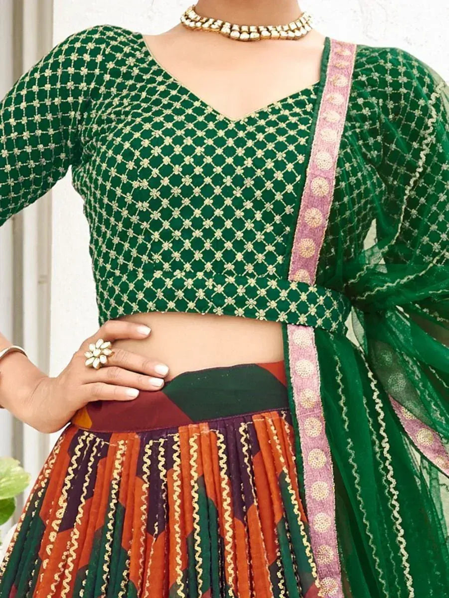 Green embroidered lehenga choli with colorful pleated skirt and dupatta, ethnic Indian wear
