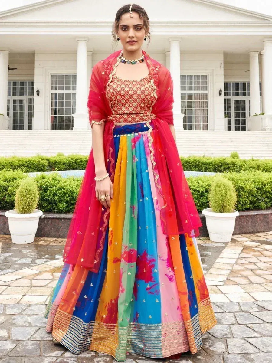 Vibrant rainbow lehenga choli with embroidered blouse and sheer dupatta, perfect for Indian ethnic occasions