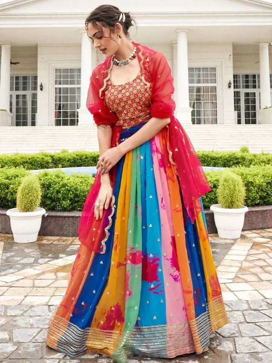 Vibrant rainbow lehenga choli with red dupatta, perfect for Indian ethnic wear and festive occasions