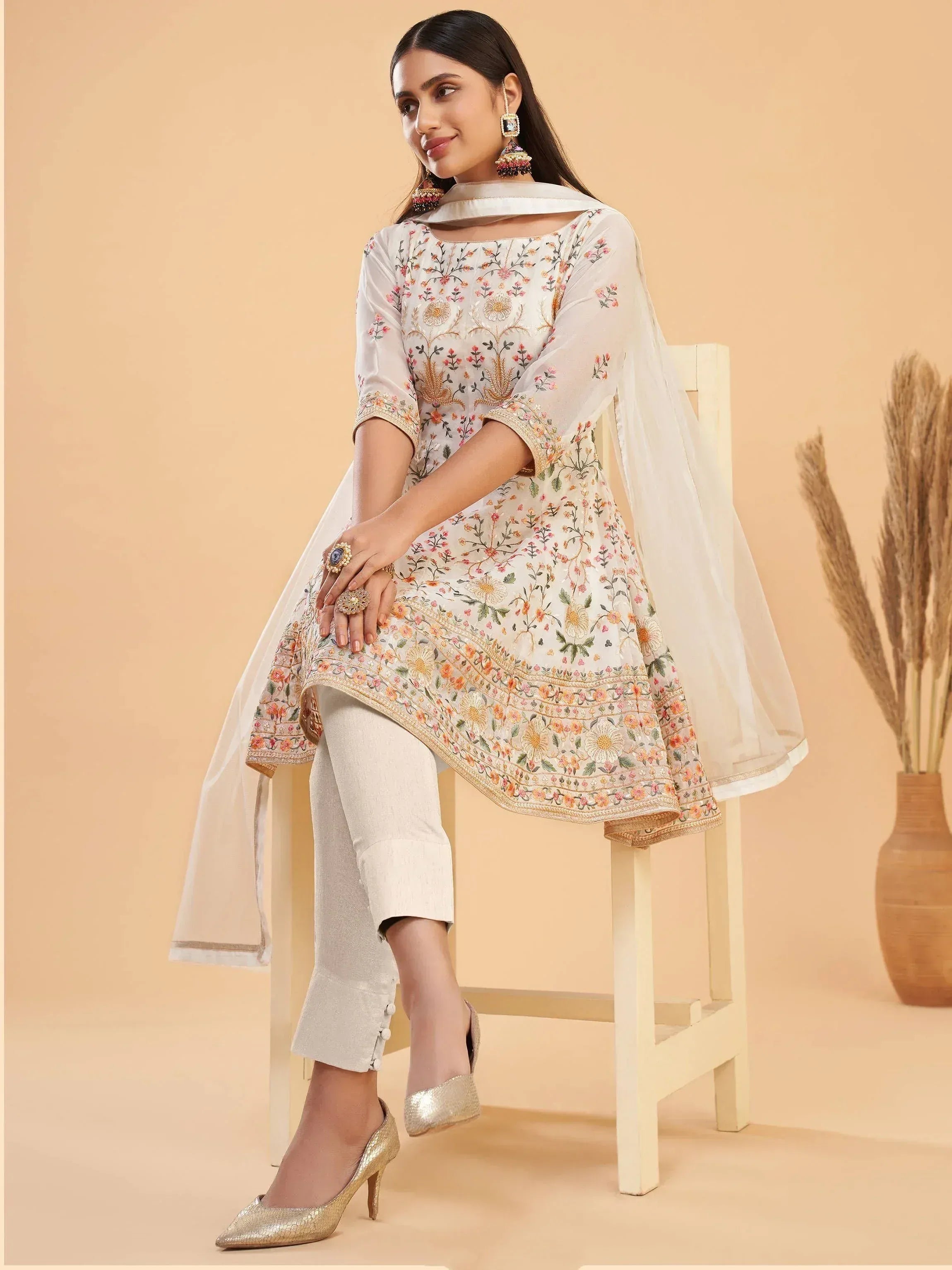 Elegant floral embroidered kurta with matching pants and dupatta, perfect for ethnic occasions.