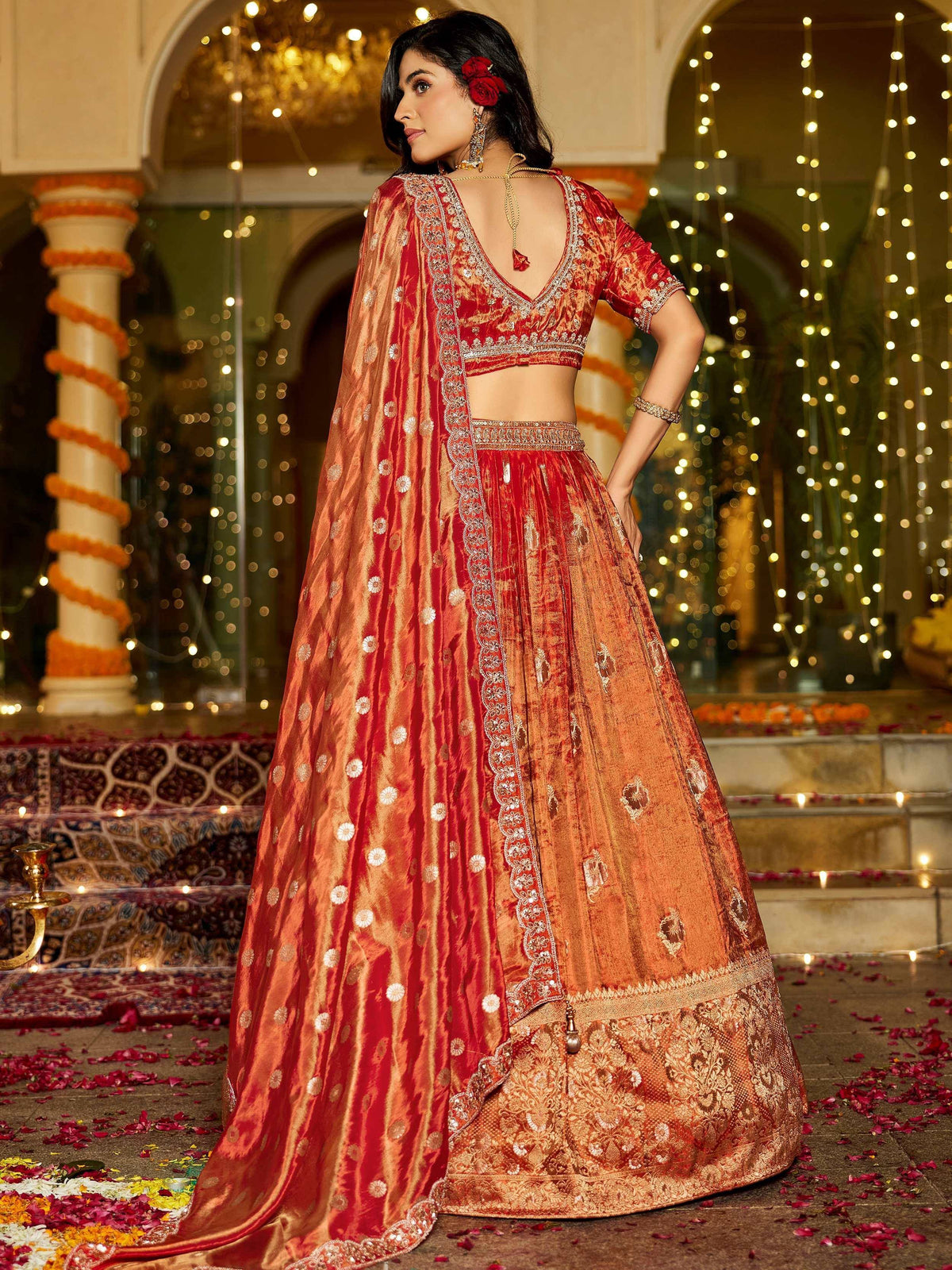 Red and gold embroidered lehenga choli with dupatta, perfect for Indian weddings and festive occasions.