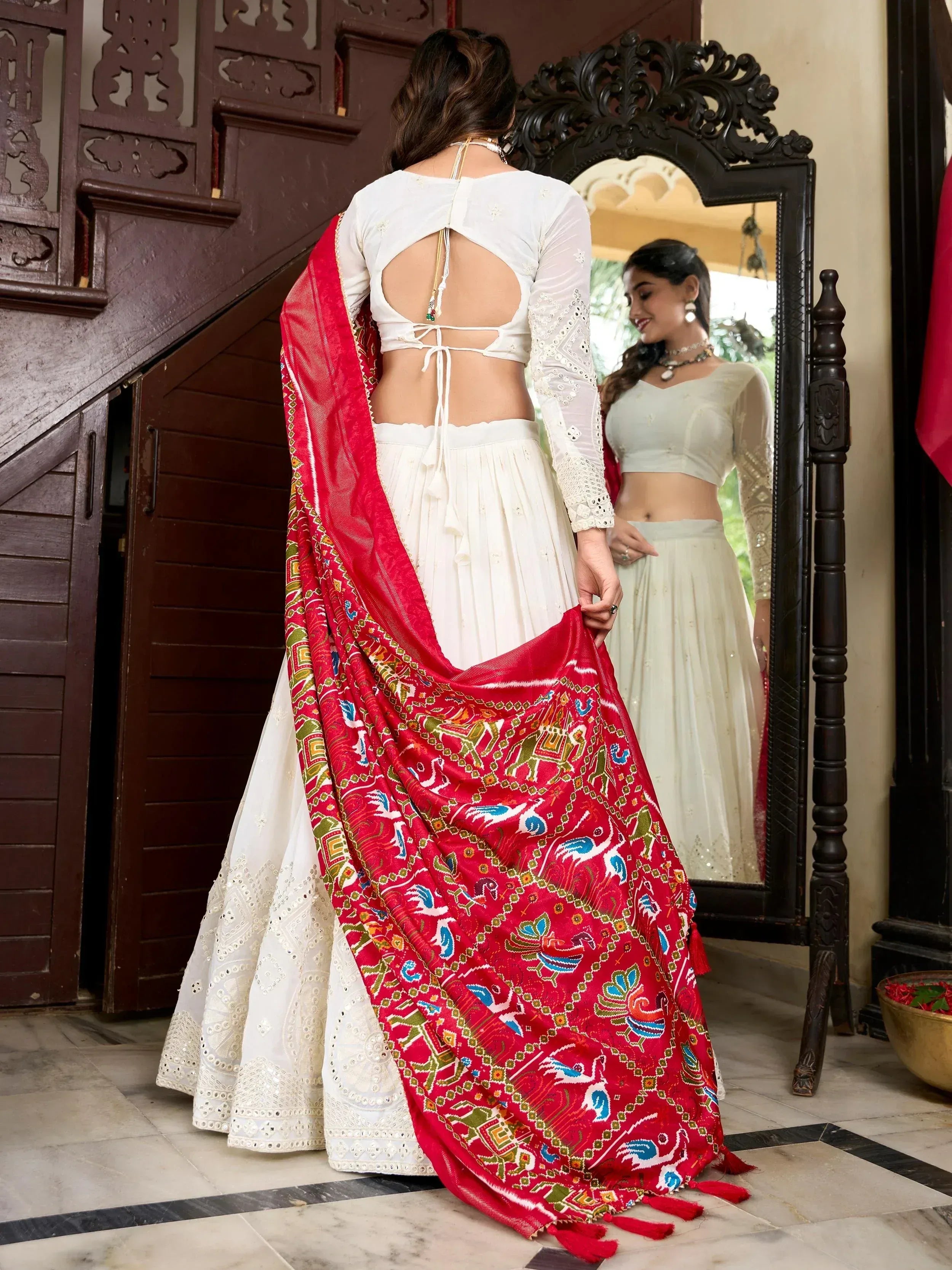 White embroidered lehenga with red printed dupatta, backless blouse, ethnic wear for women