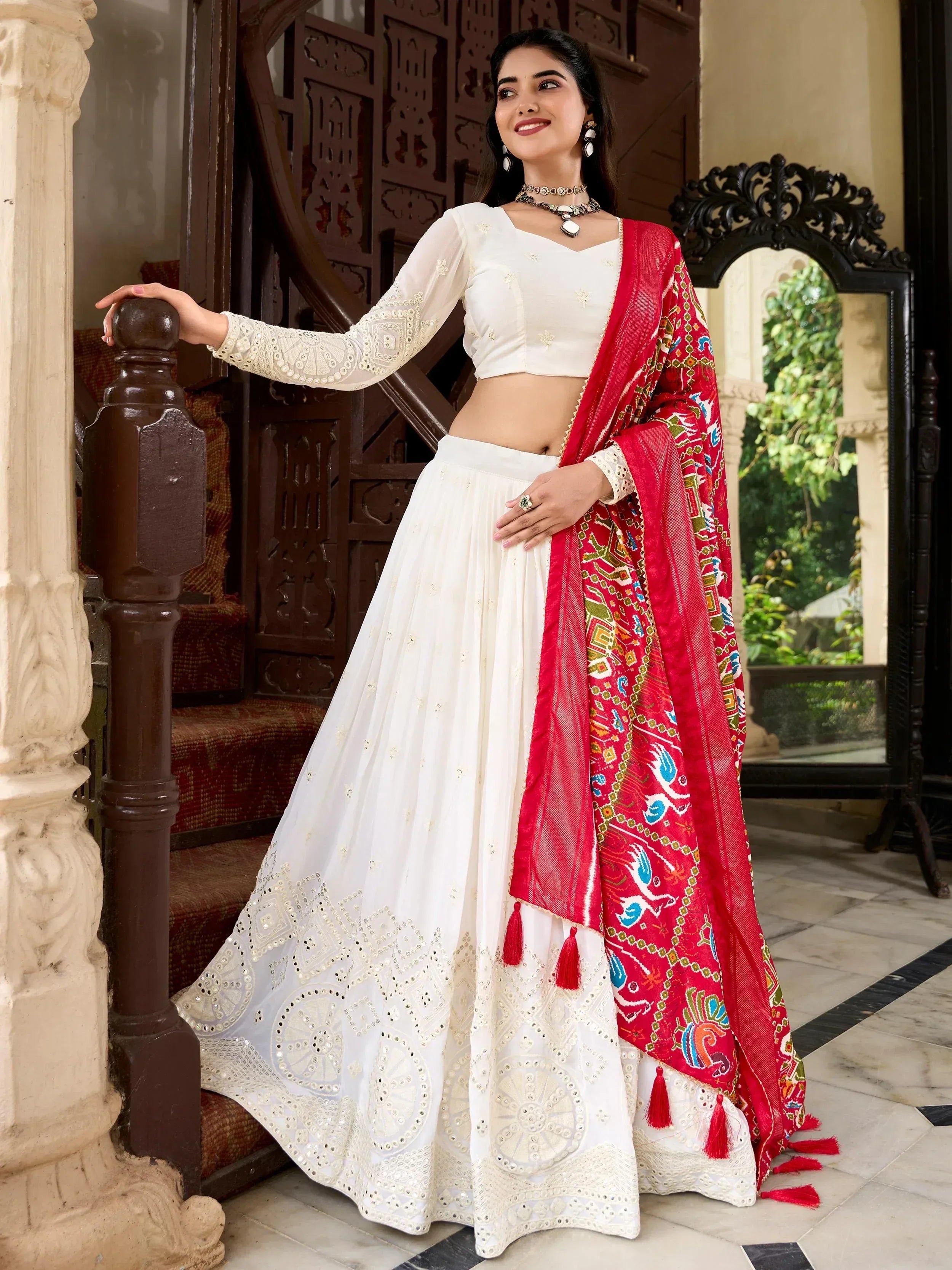 White embroidered lehenga with red printed dupatta, ethnic Indian wear for festive occasions