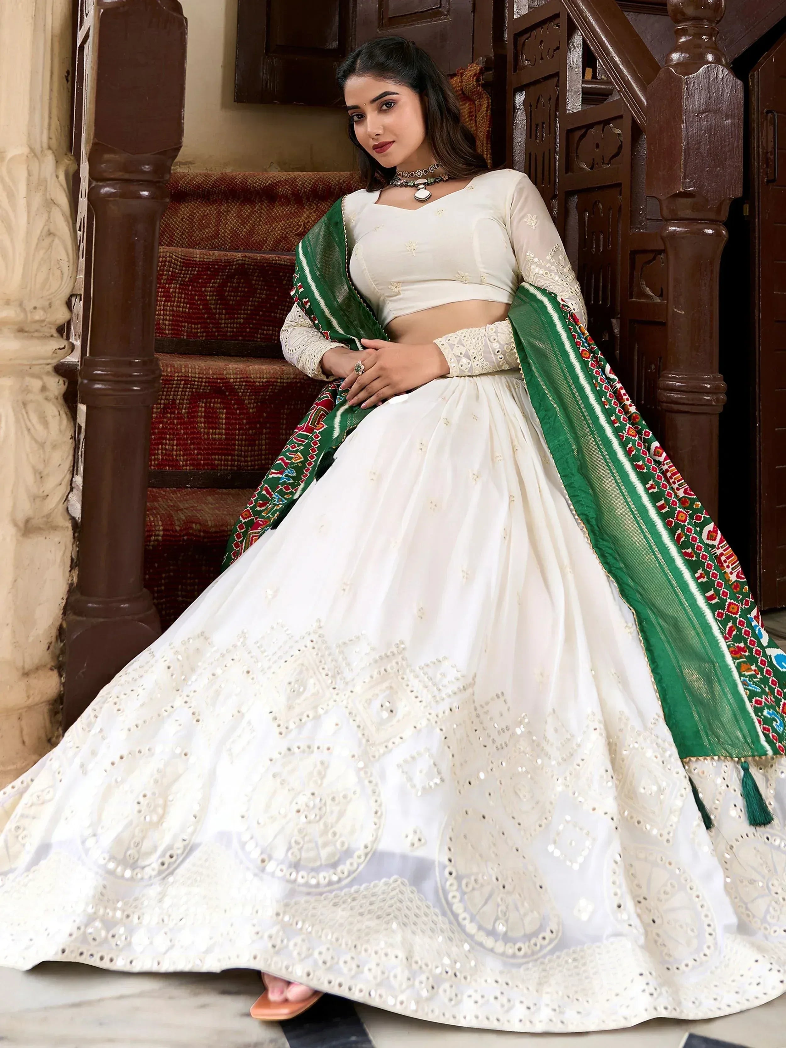White embroidered lehenga choli with green dupatta, traditional Indian ethnic wear