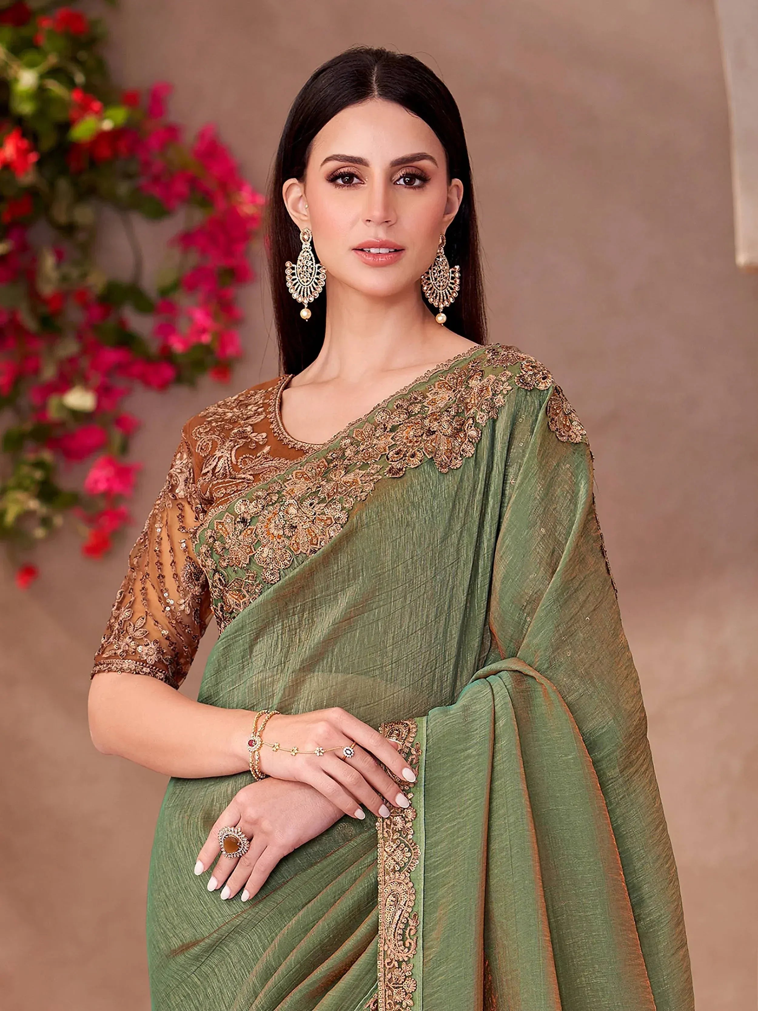 Elegant green saree with gold embroidery, perfect for Indian ethnic wear and festive occasions.