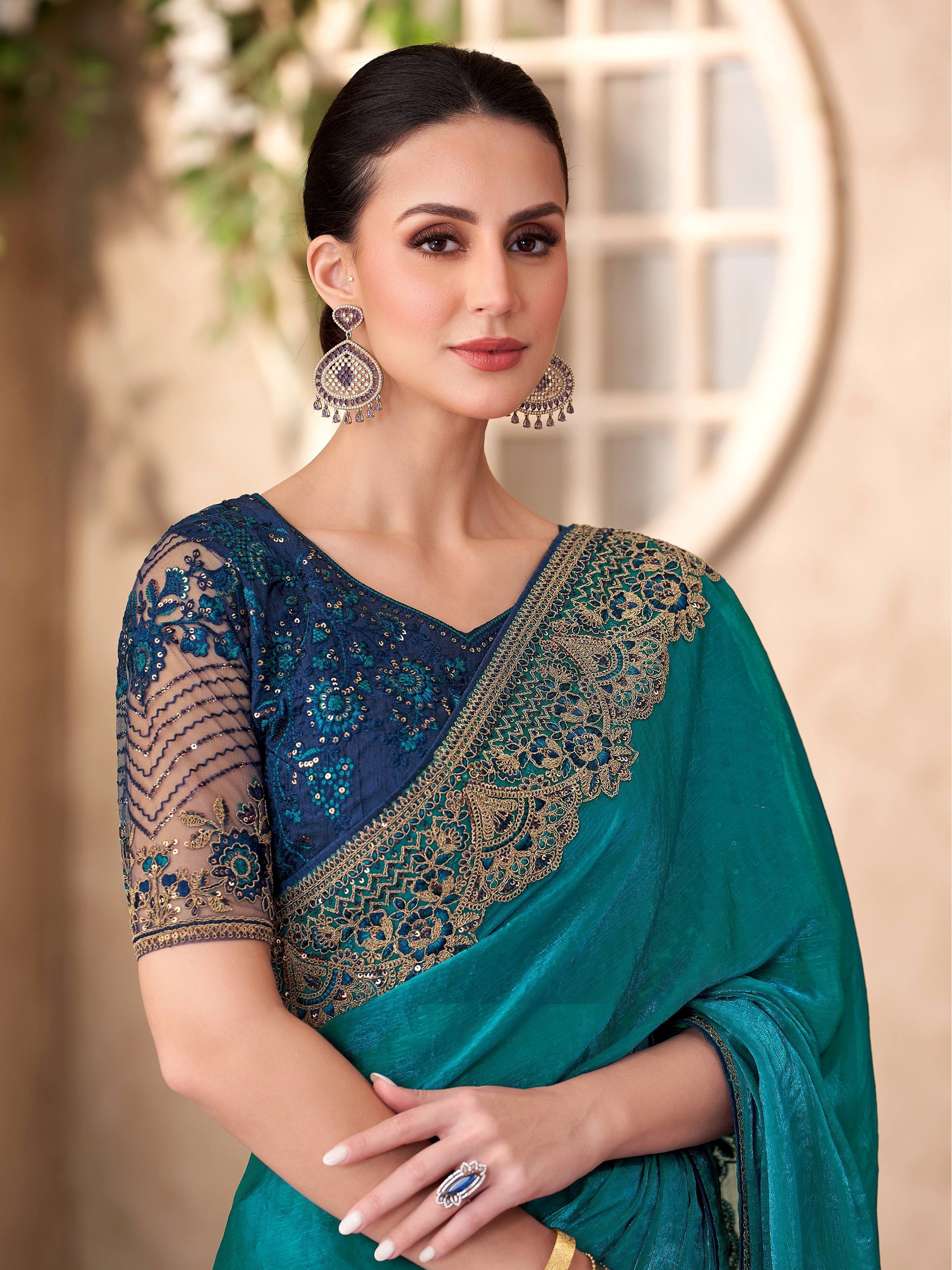 Elegant teal and navy blue embroidered saree with gold detailing, perfect for Indian ethnic occasions