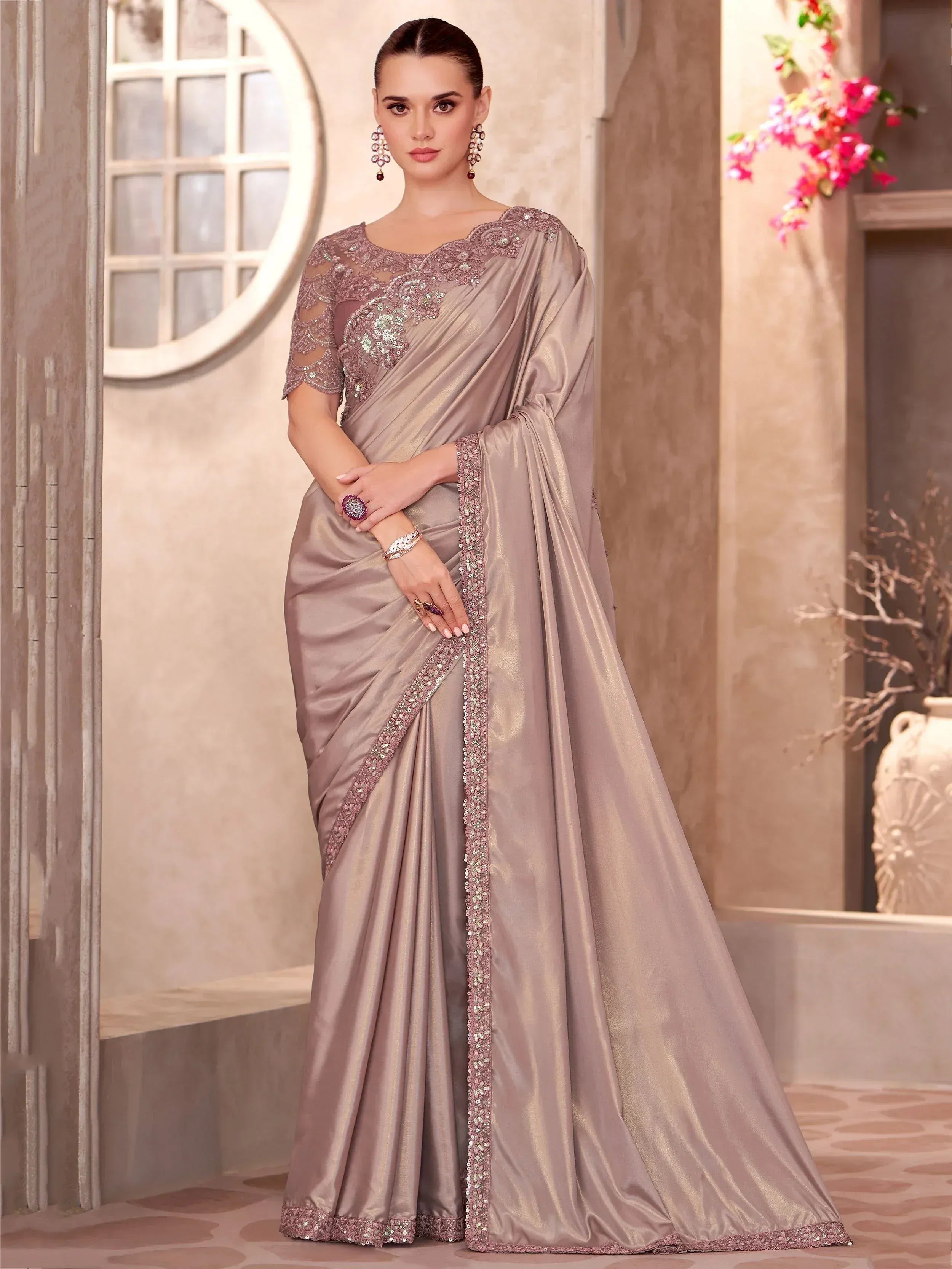 Elegant mauve saree with intricate embroidery and sequin detailing, perfect for Indian ethnic occasions.