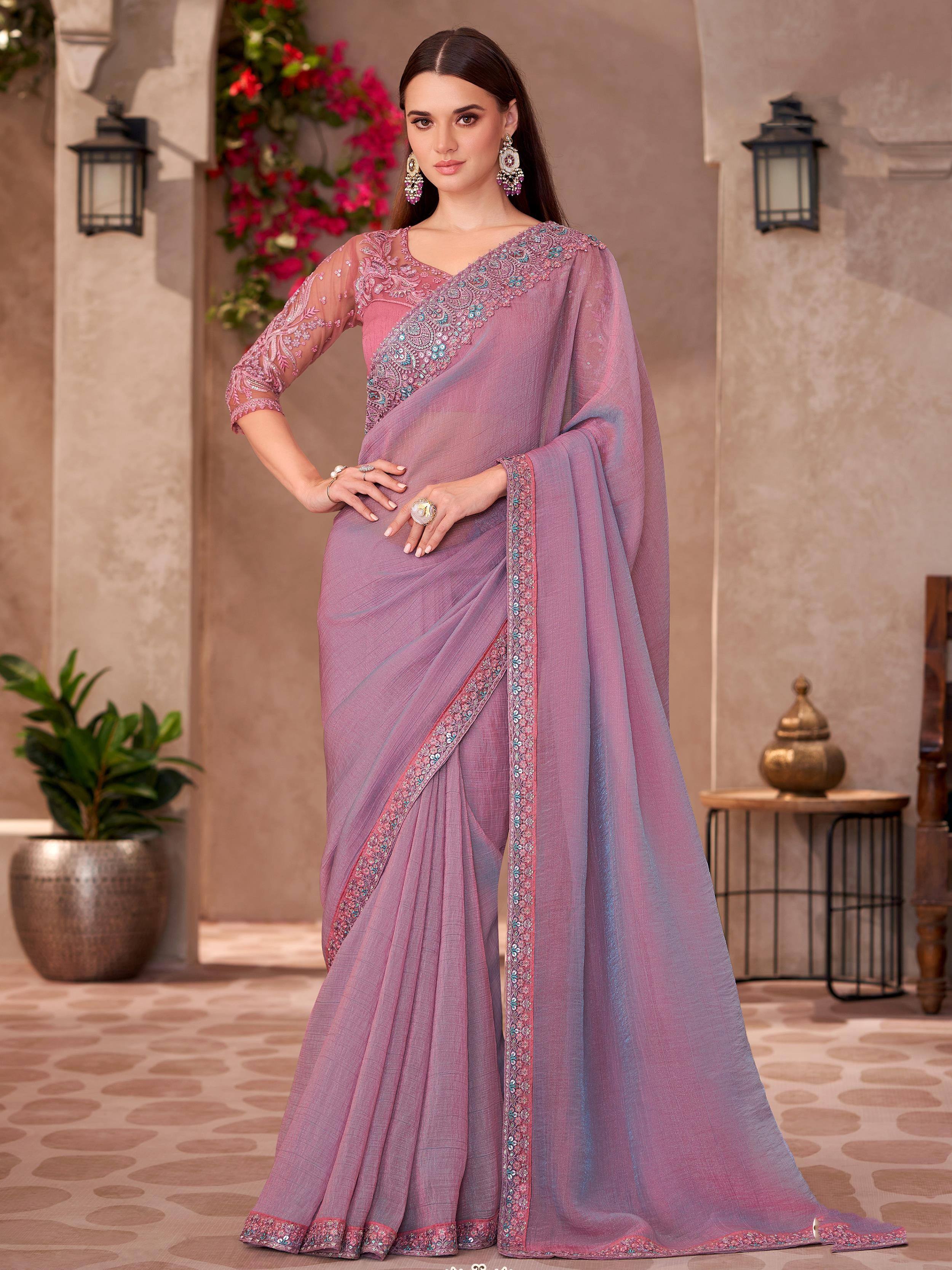 Elegant mauve saree with intricate embroidery and sheer blouse, perfect for Indian ethnic occasions.