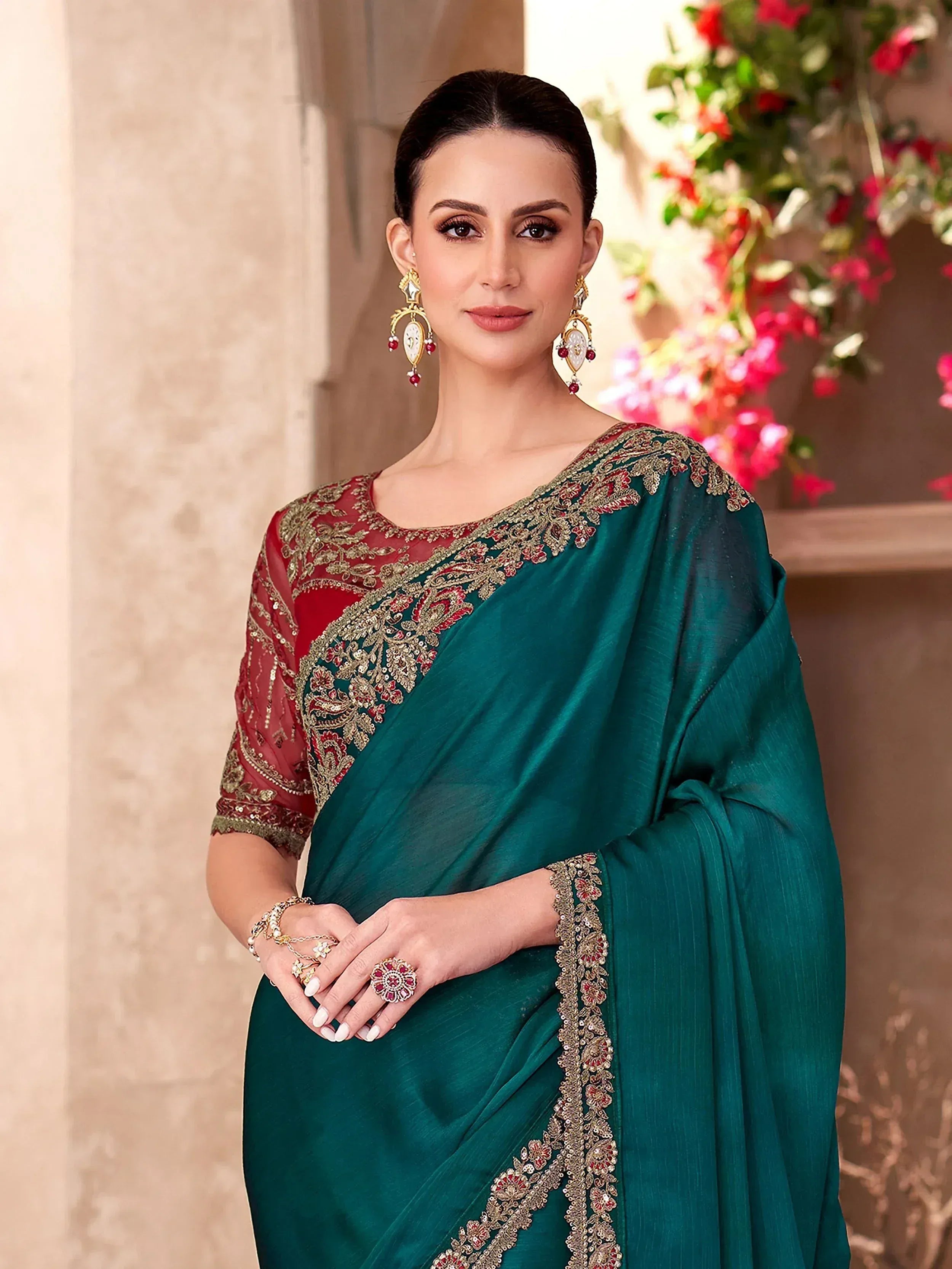 Emerald green saree with red blouse and gold embroidery, perfect for Indian ethnic occasions