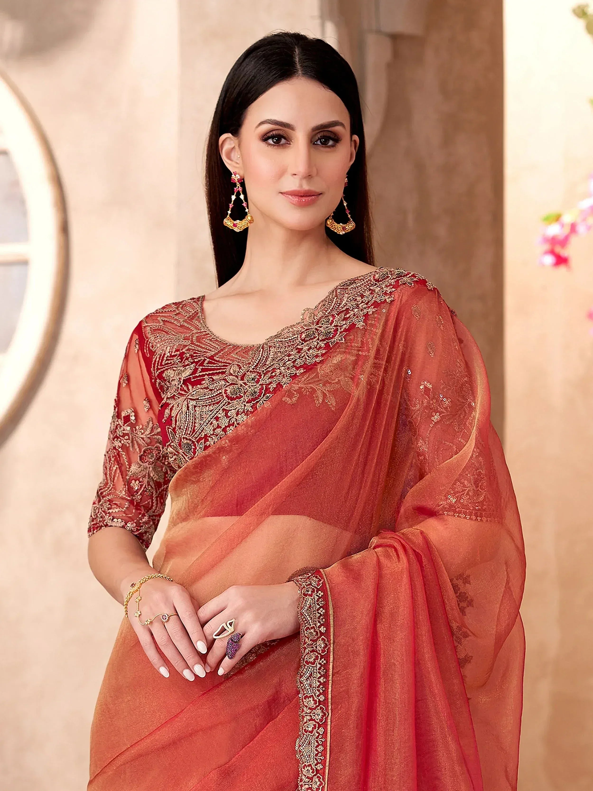 Elegant red embroidered saree with gold detailing, perfect for Indian ethnic wear occasions.