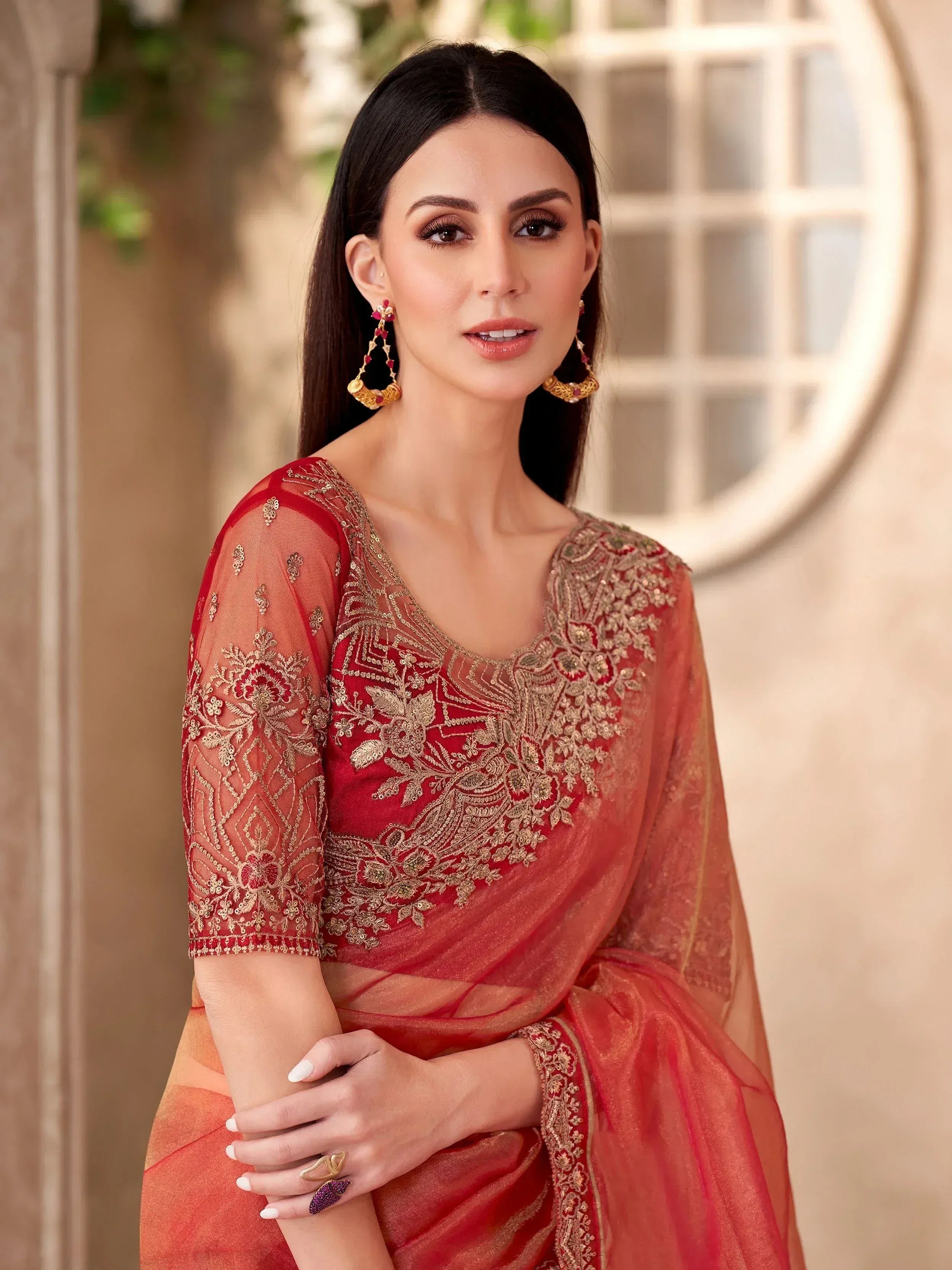 Elegant red embroidered saree with gold detailing, perfect for Indian ethnic wear occasions