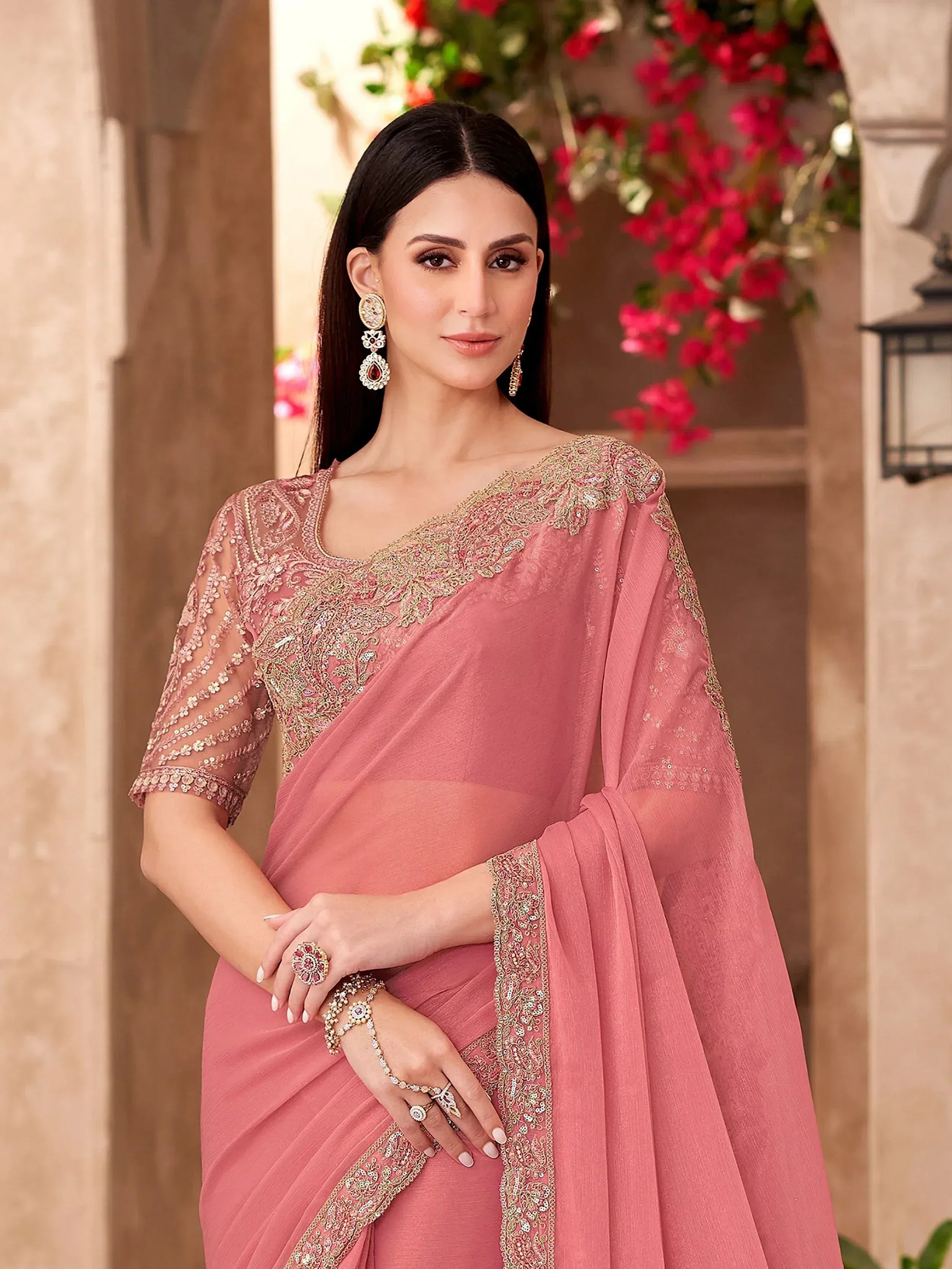 Pink embroidered saree with gold detailing, perfect for Indian ethnic wear occasions.