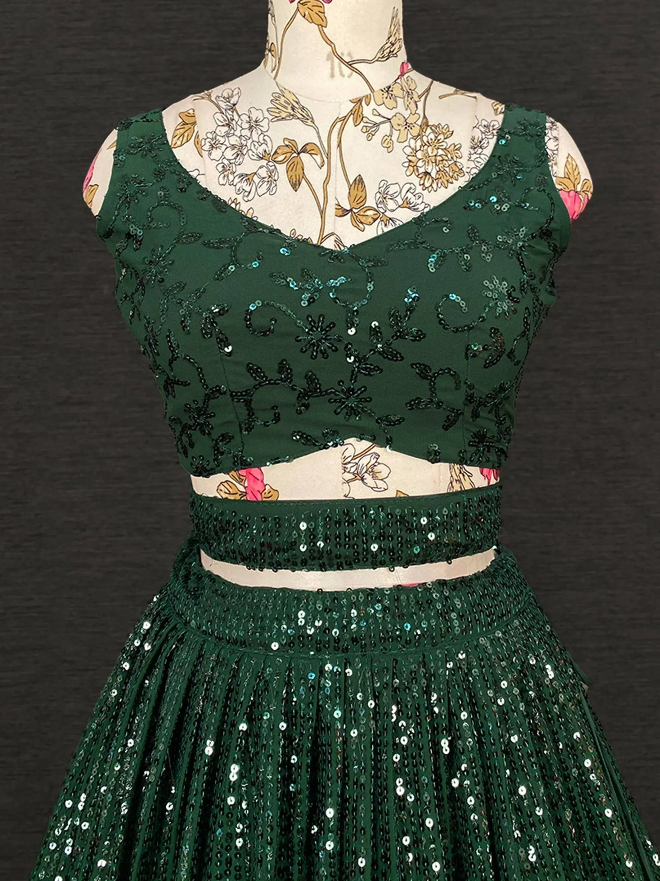 Emerald green sequin lehenga choli with floral embroidery, perfect for Indian ethnic wear events.