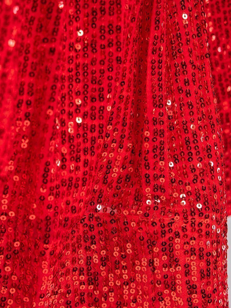 Red sequin ethnic gown fabric detail, shimmering for festive occasions