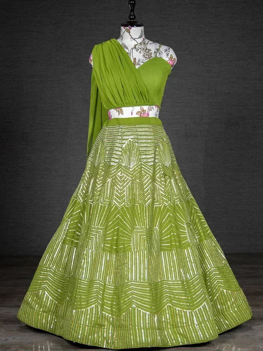 Vibrant green lehenga choli with geometric embroidery, floral blouse, and draped dupatta for ethnic occasions