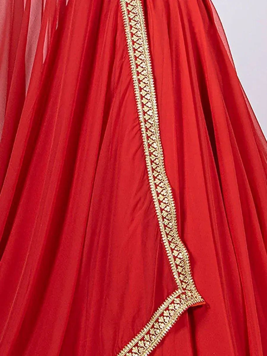 Red ethnic lehenga with gold embroidery detail, perfect for Indian weddings and festive occasions.