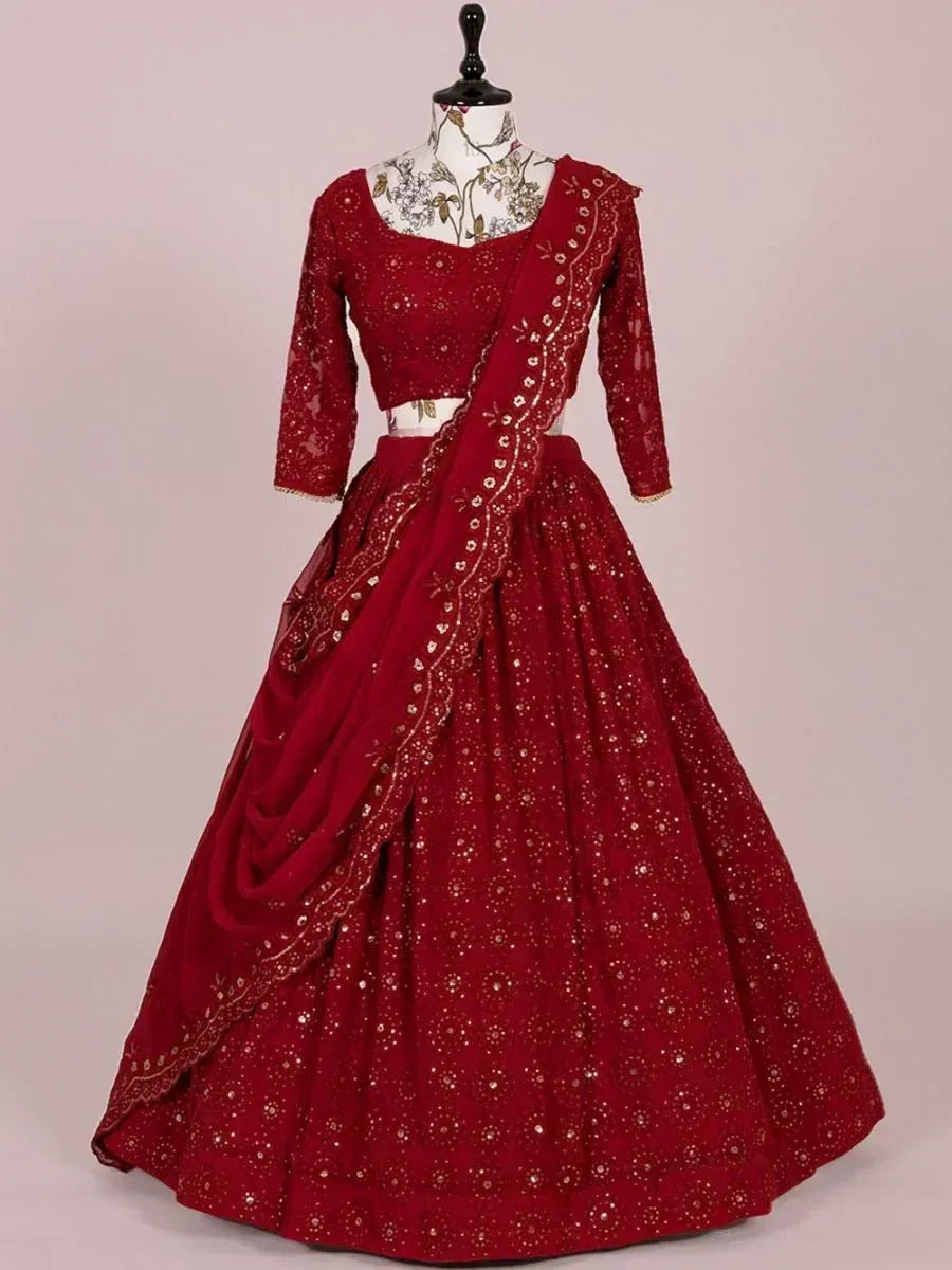 Red embroidered lehenga choli with gold detailing, perfect for Indian weddings and festive occasions