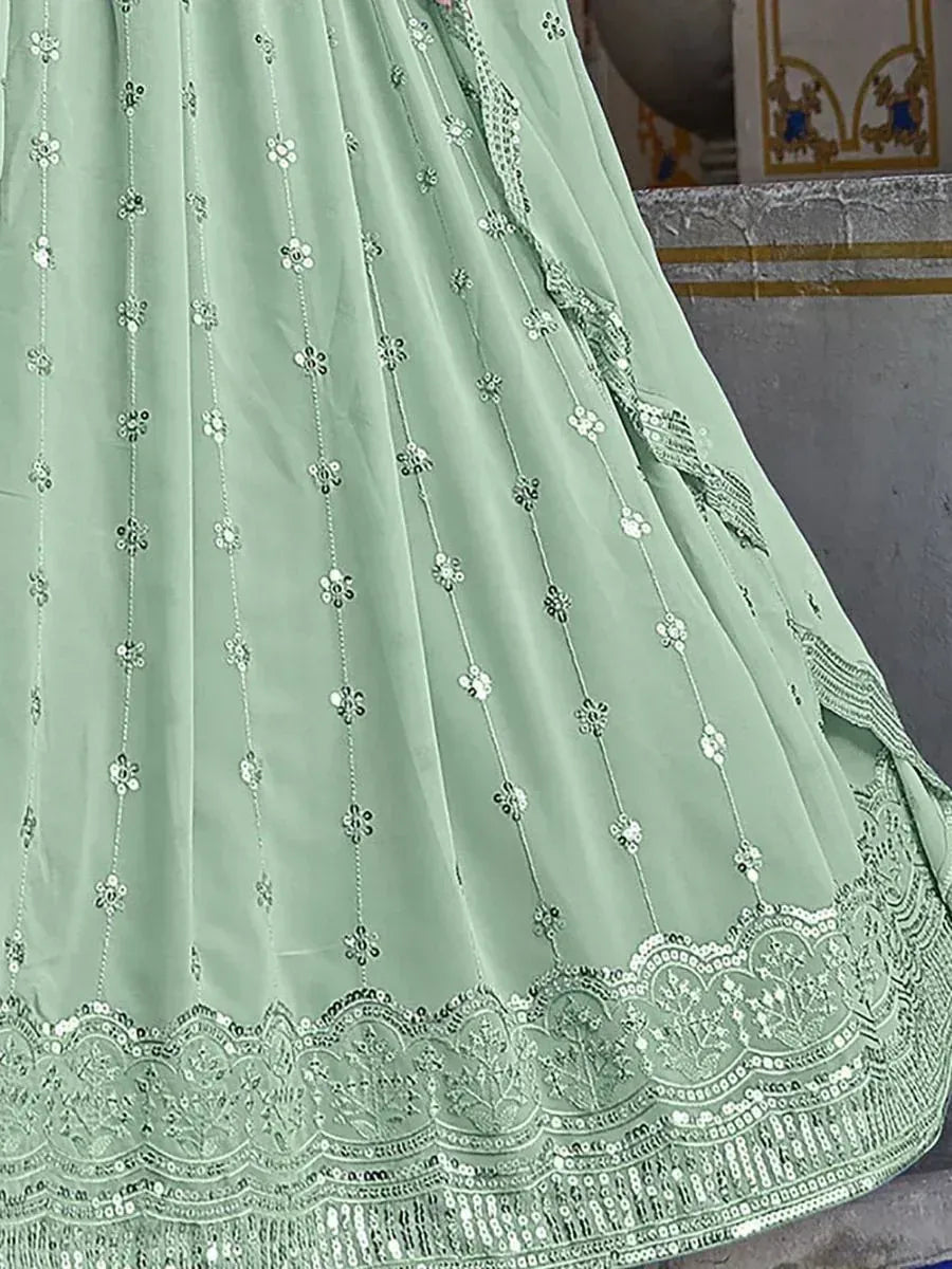 Mint green lehenga with floral embroidery and sequin border, perfect for Indian ethnic wear