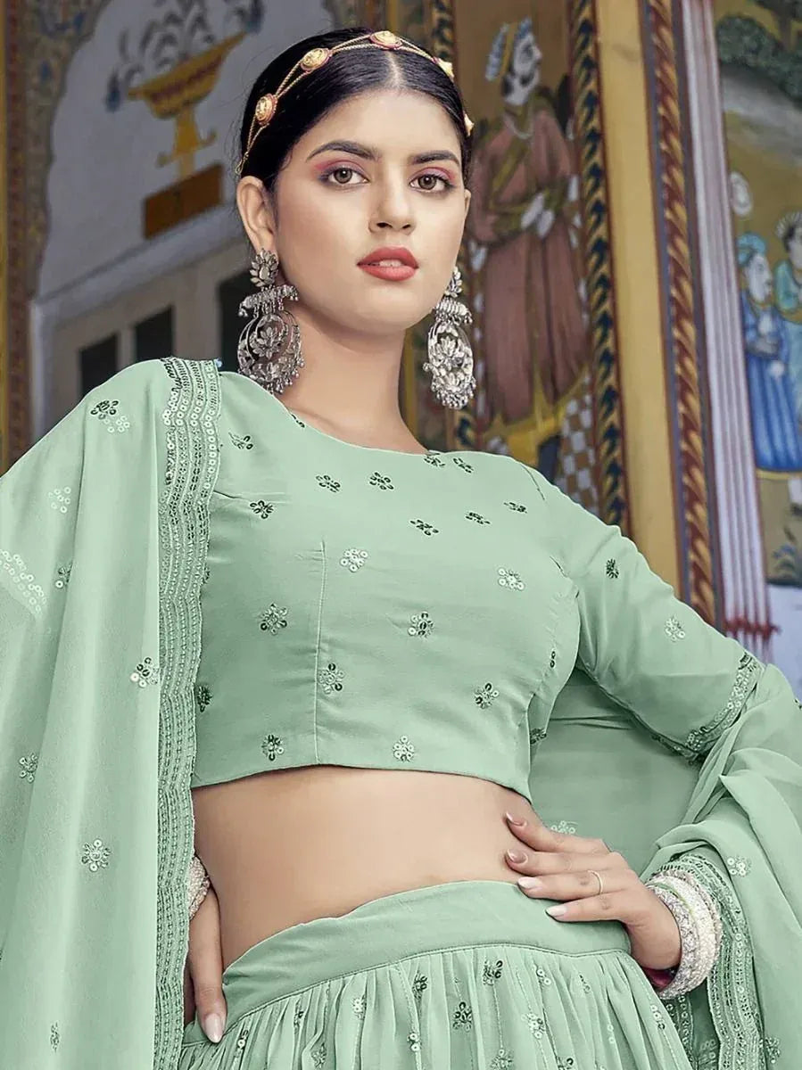 Mint green embroidered lehenga choli with matching dupatta, traditional Indian ethnic wear for women