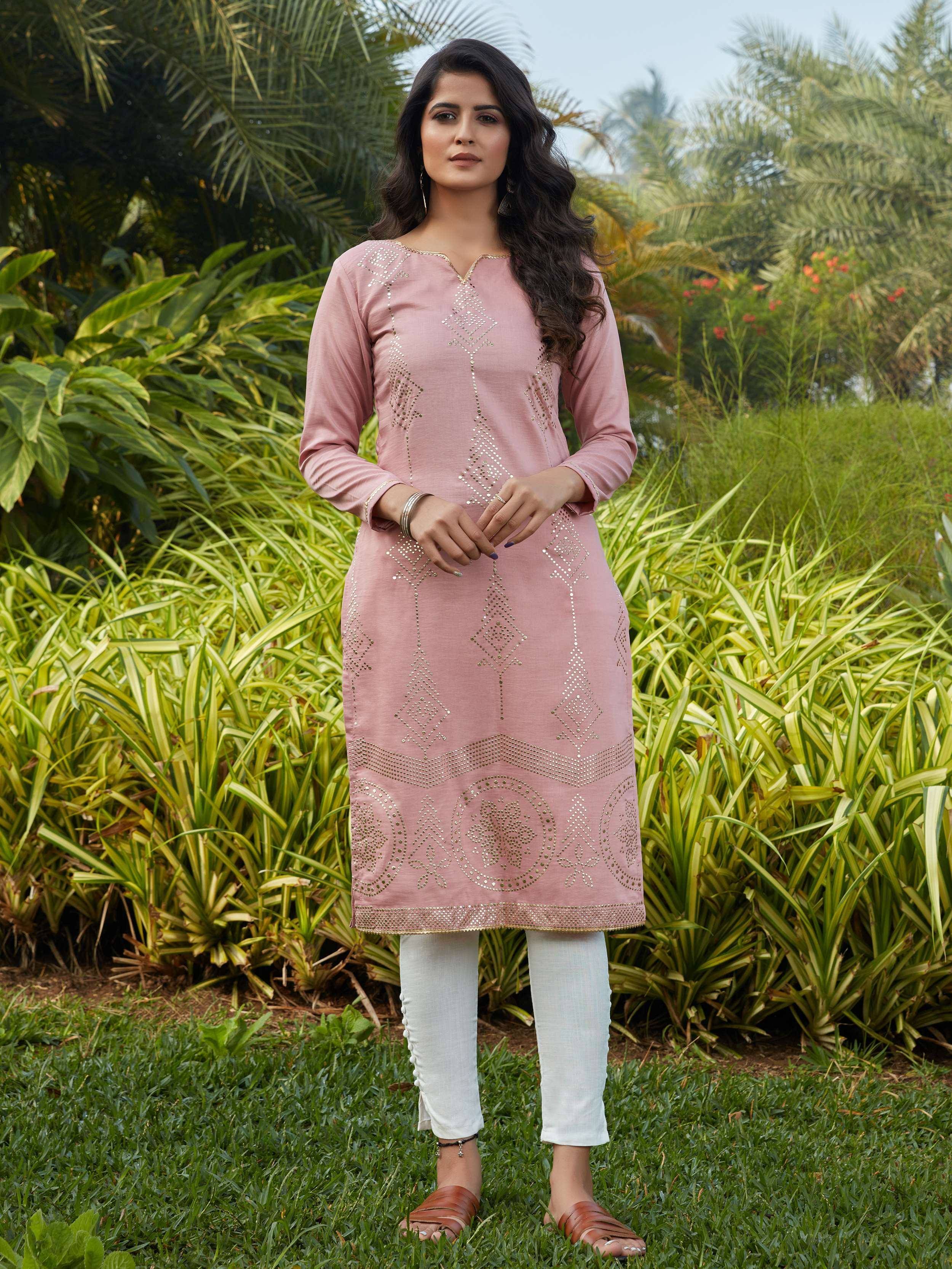 Pink embroidered kurta with white pants, Indian ethnic wear for women, garden setting