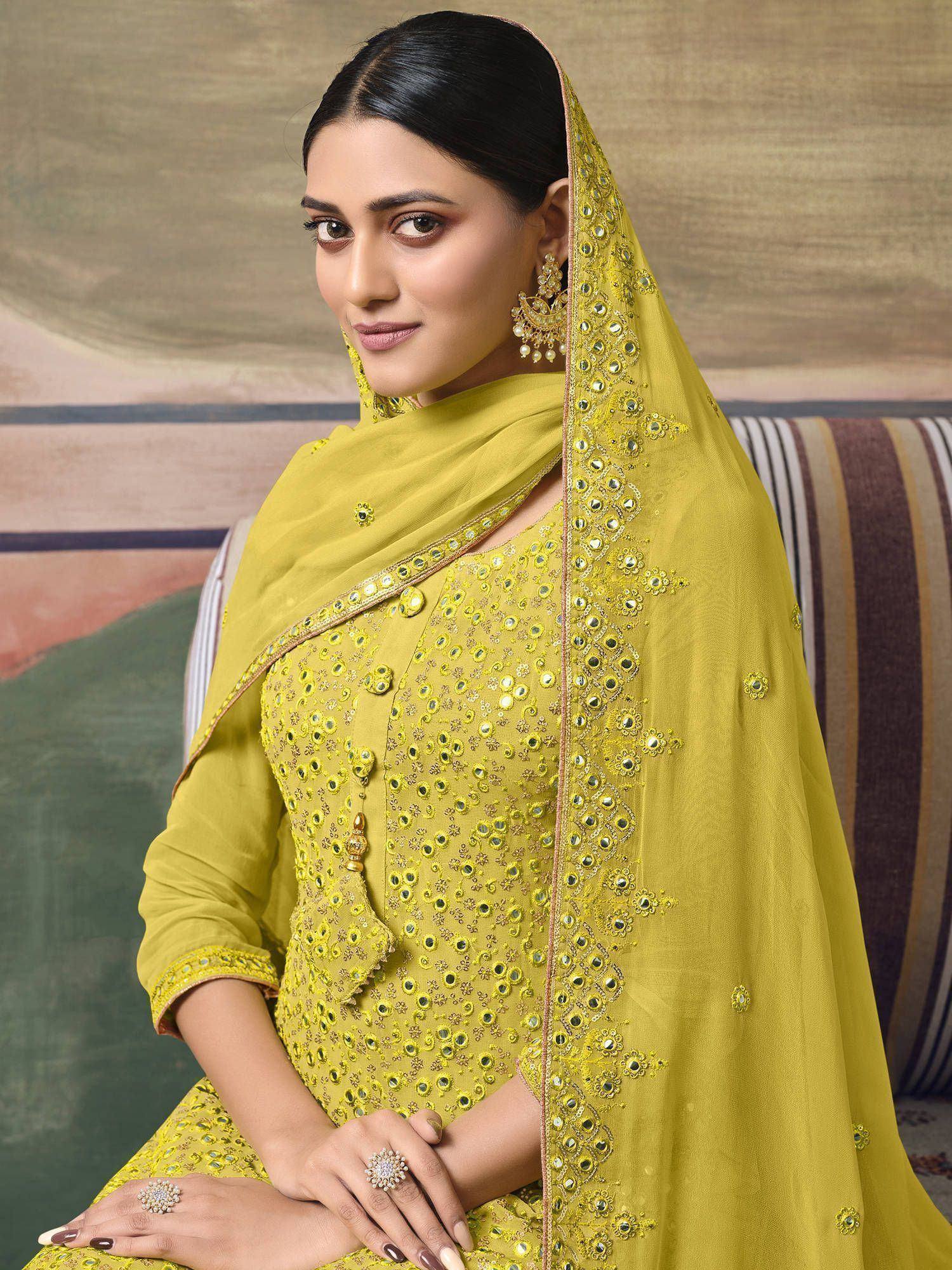 Yellow ethnic salwar kameez with mirror work and dupatta, perfect for Indian occasions