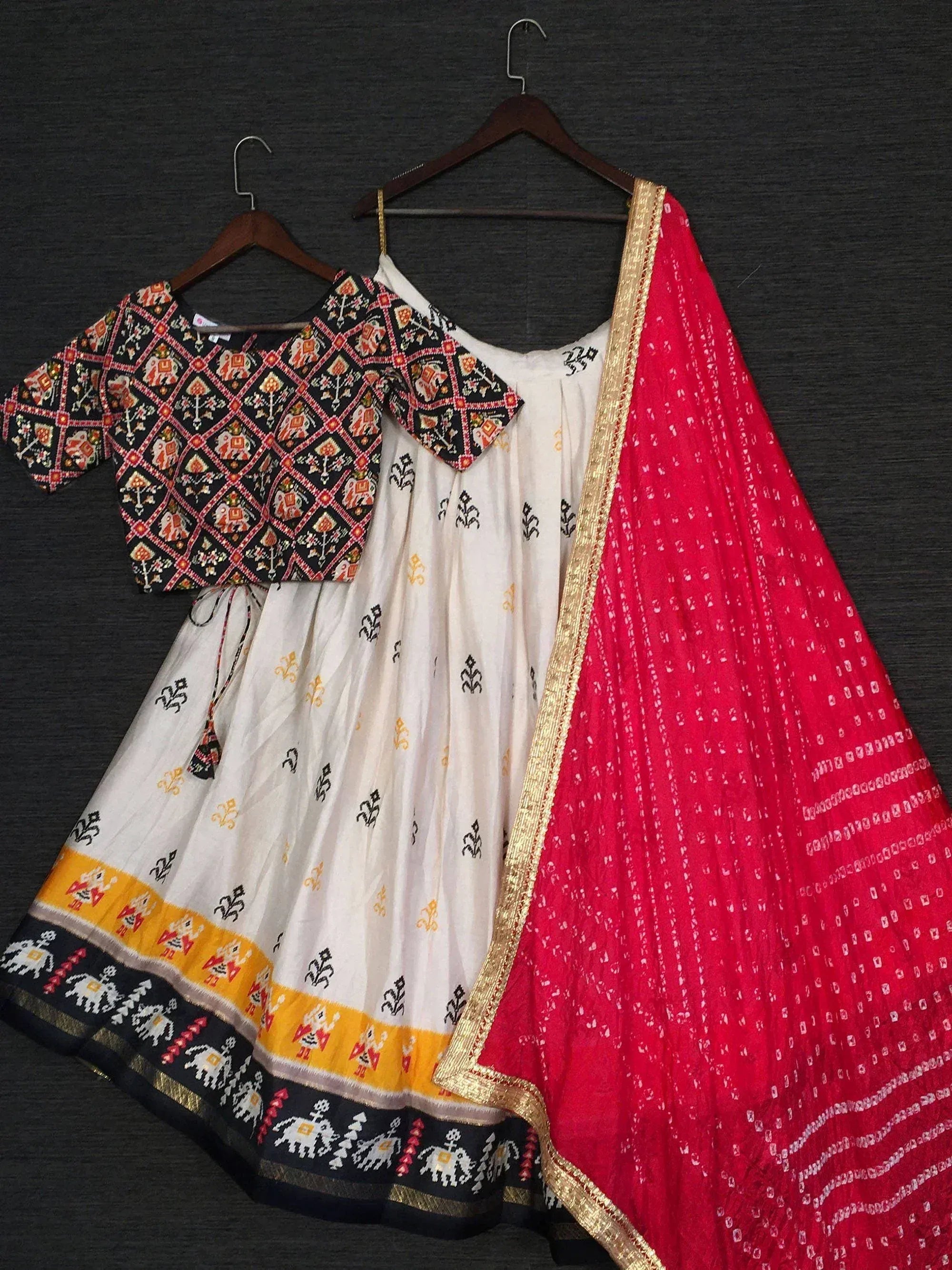White printed lehenga with black and red embroidered blouse and red dupatta, Indian ethnic wear