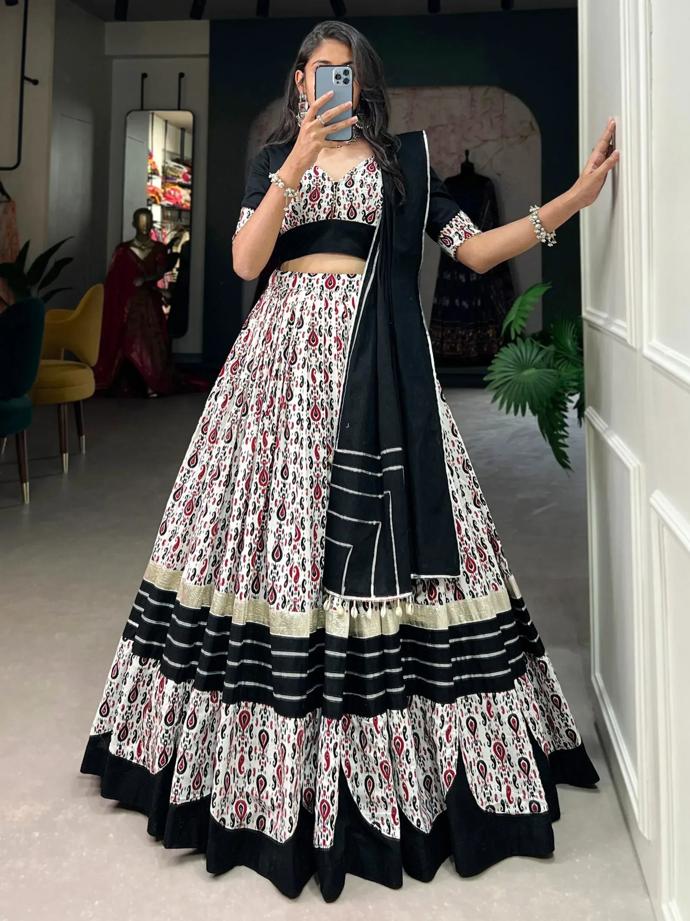 Woman in black and white printed lehenga choli with dupatta, ethnic Indian wear for festive occasions