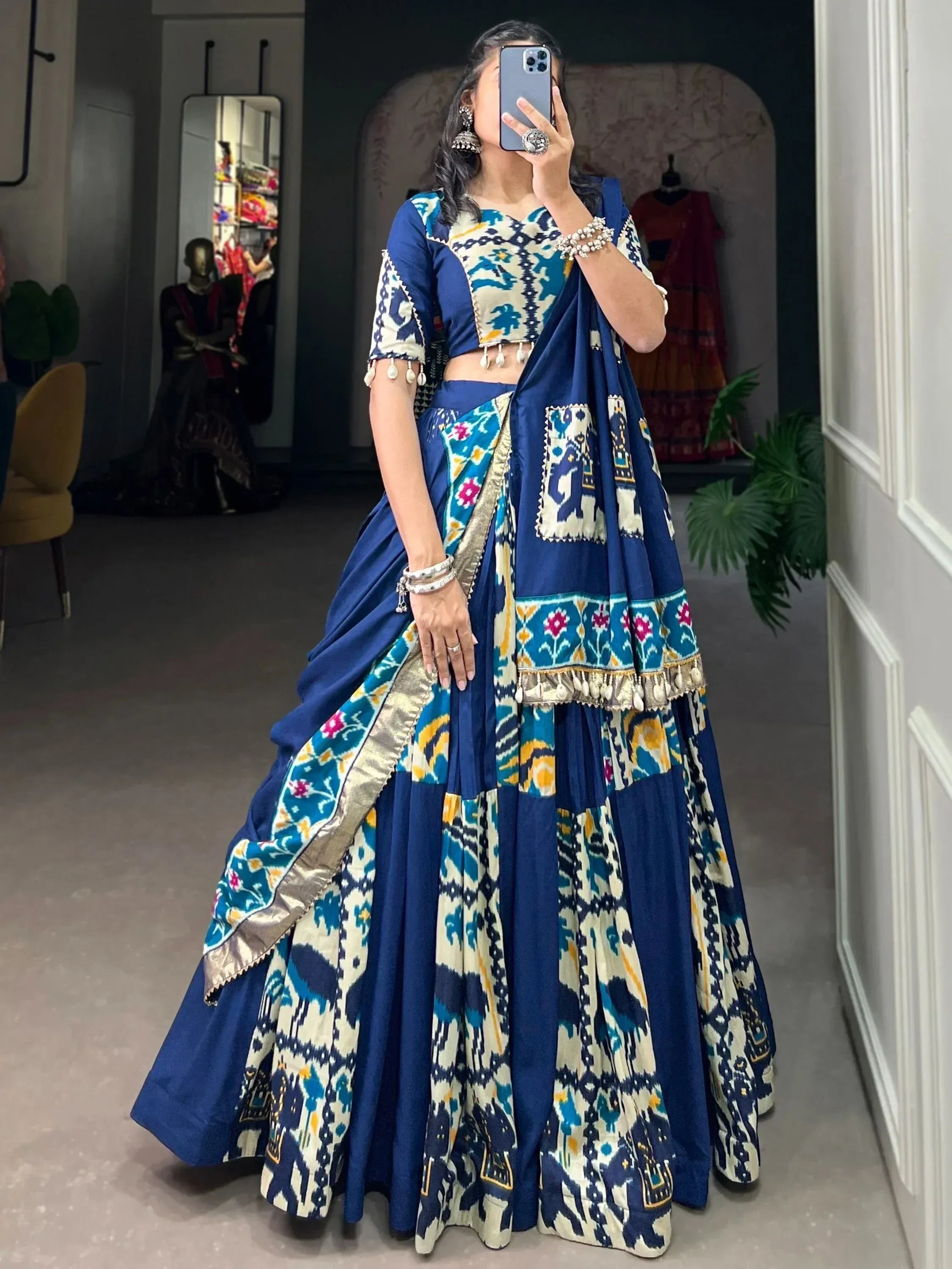 Blue and cream ikat print lehenga choli with floral border, perfect for Indian ethnic wear occasions