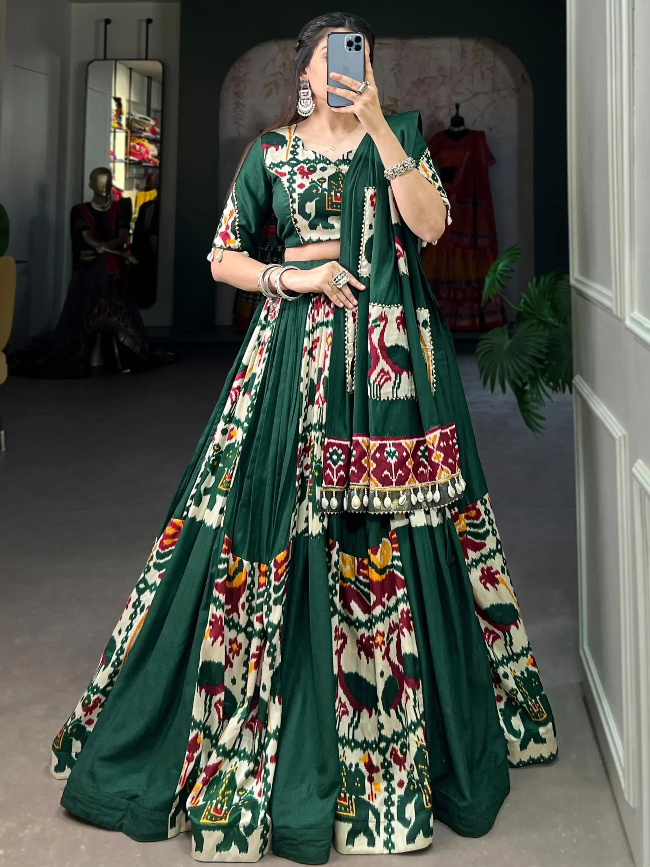 Green and cream printed lehenga choli with ethnic embroidery, perfect for Indian festive occasions.