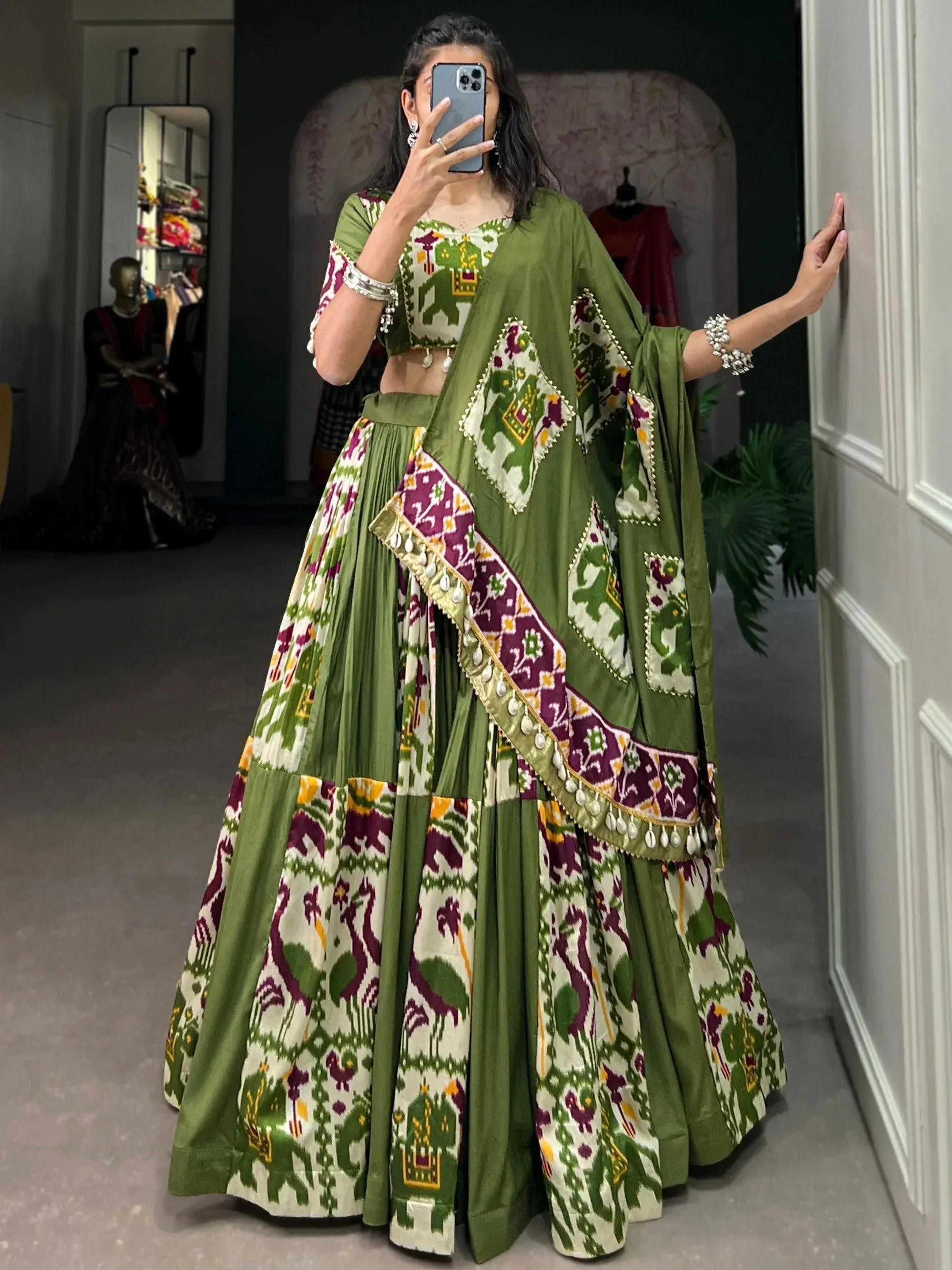 Green and purple printed lehenga choli with elephant motifs, perfect for Indian ethnic wear