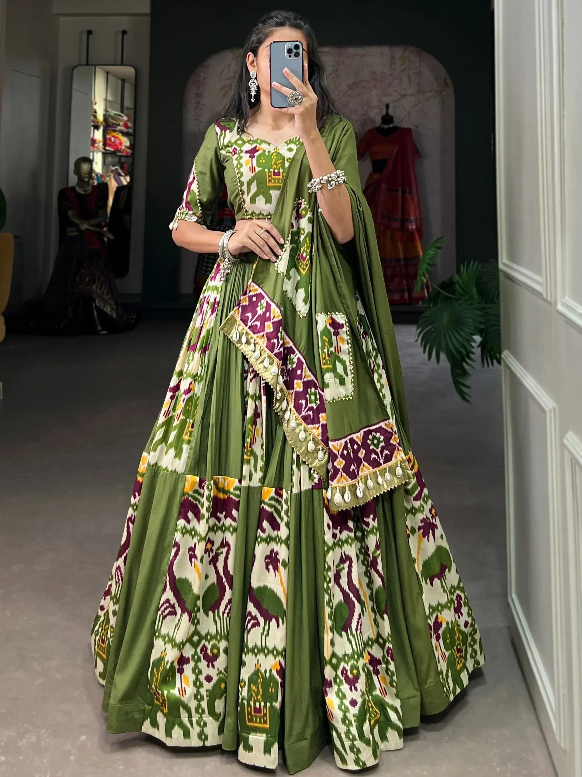 Green and purple printed lehenga choli with elephant motifs, perfect for Indian ethnic wear