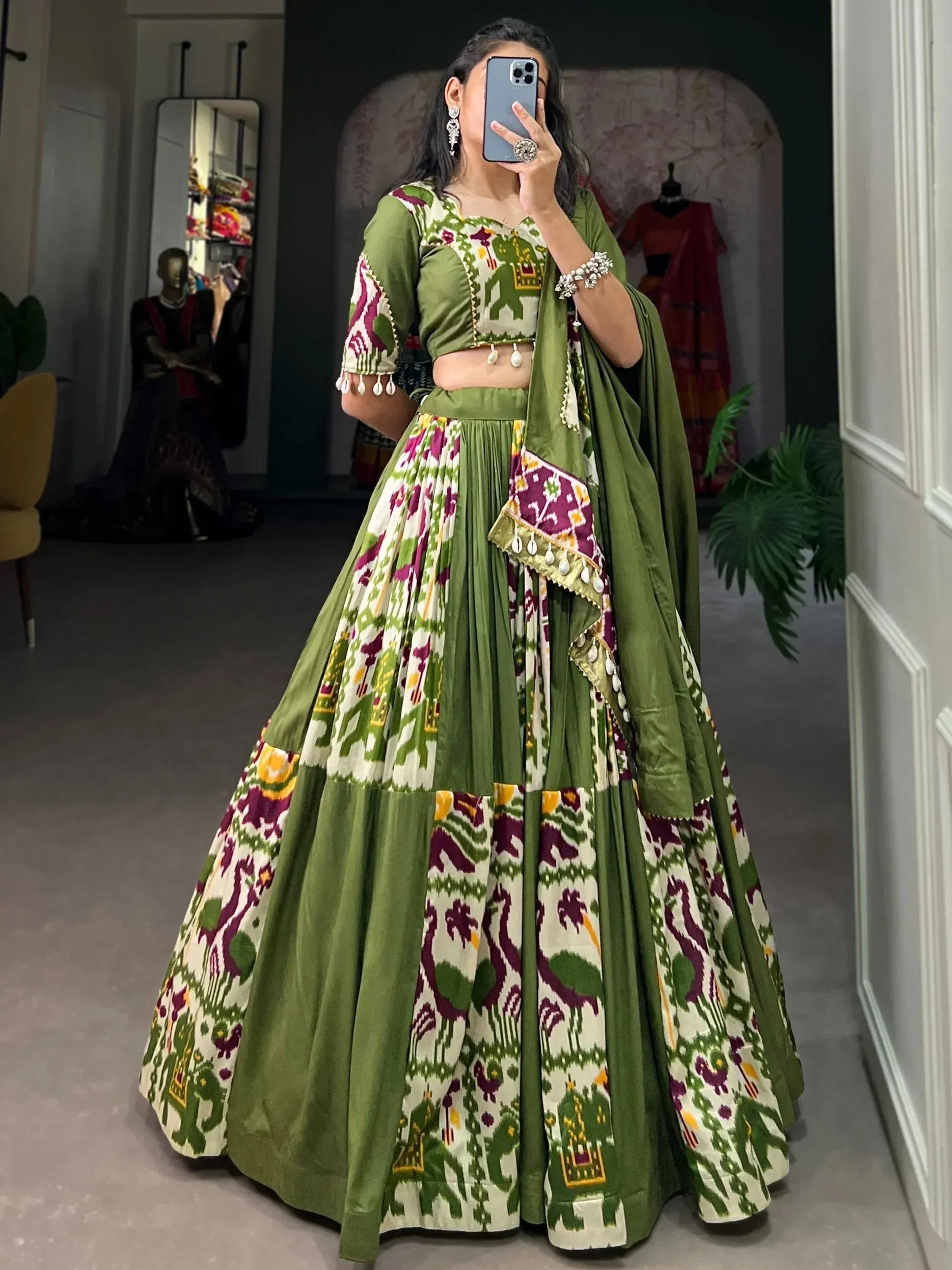 Green and white printed lehenga choli with elephant motifs, perfect for Indian ethnic wear occasions