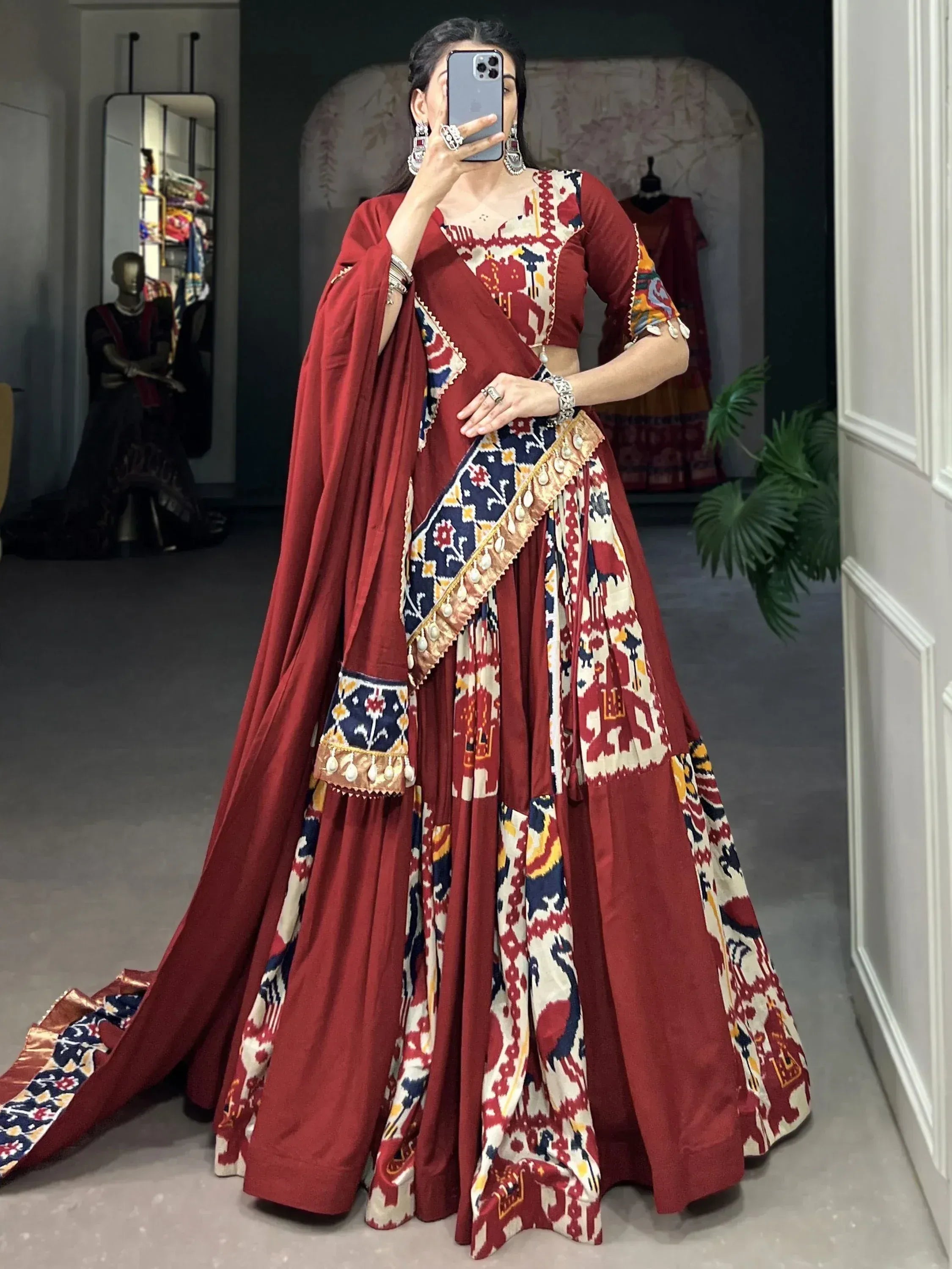 Red and printed ethnic lehenga choli with dupatta, perfect for Indian weddings and festive occasions