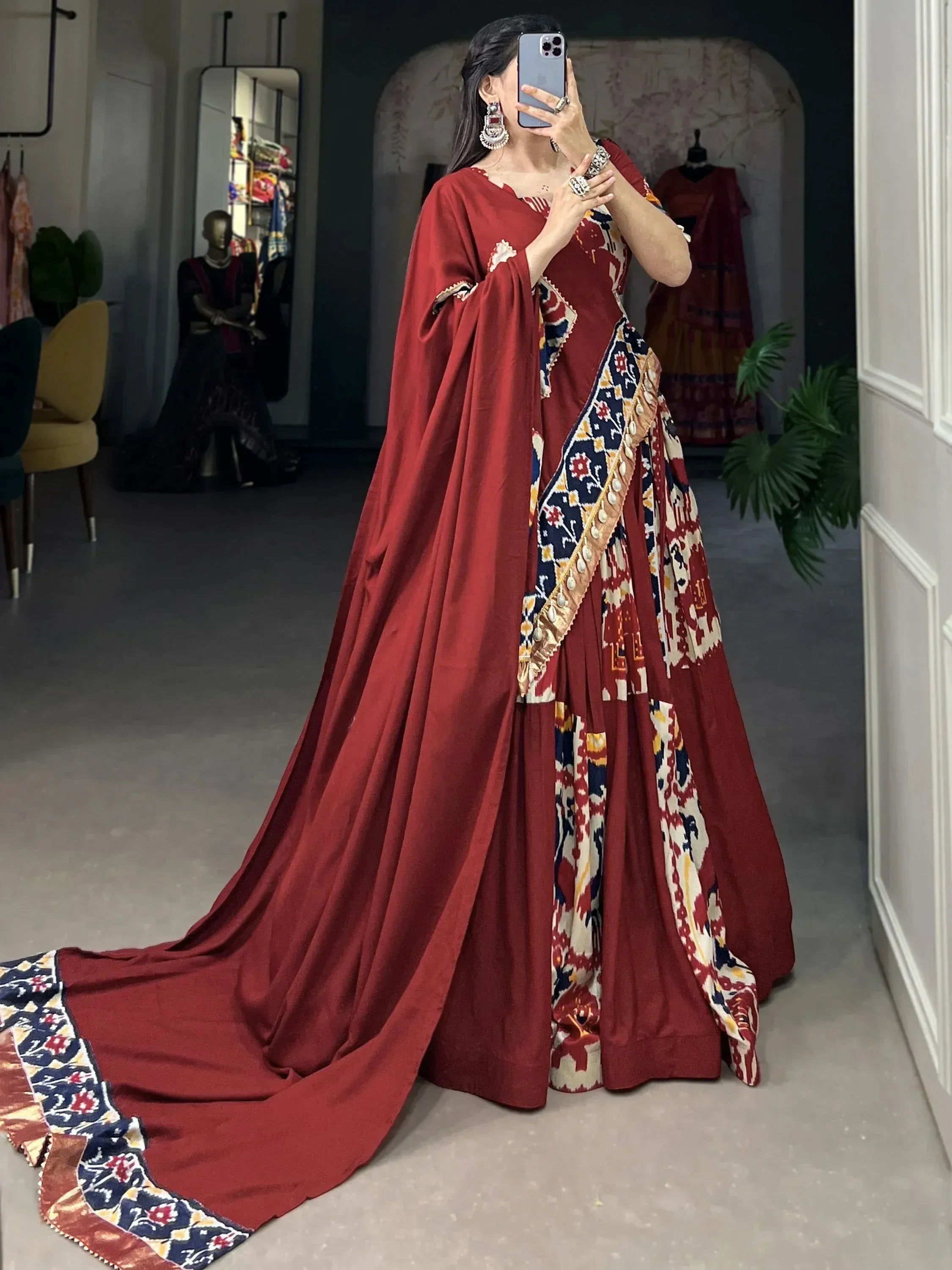 Red printed designer lehenga choli with long cape, ethnic Indian wear for weddings and parties