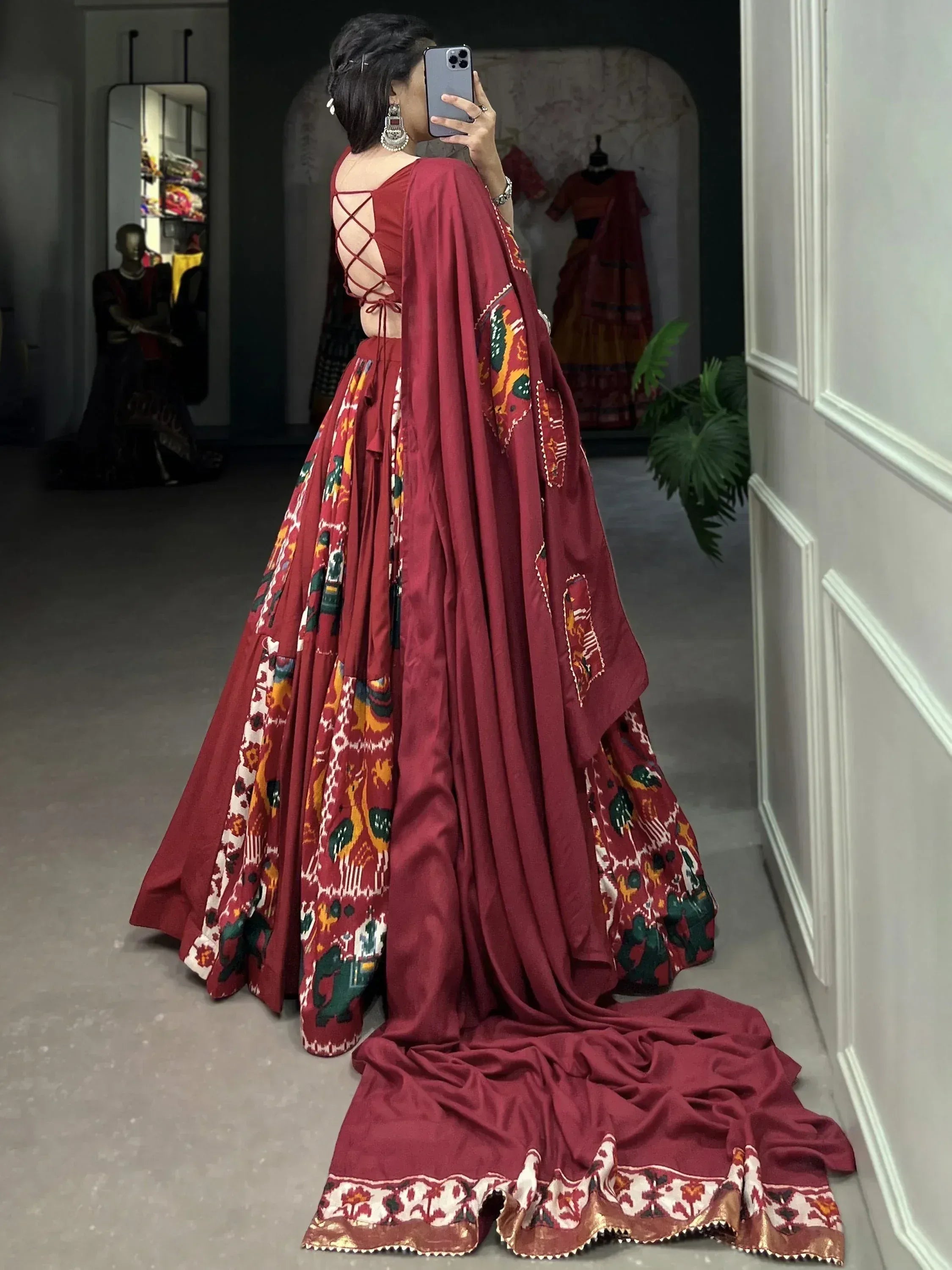 Maroon lehenga choli with ikat print and crisscross back, perfect for Indian ethnic wear occasions