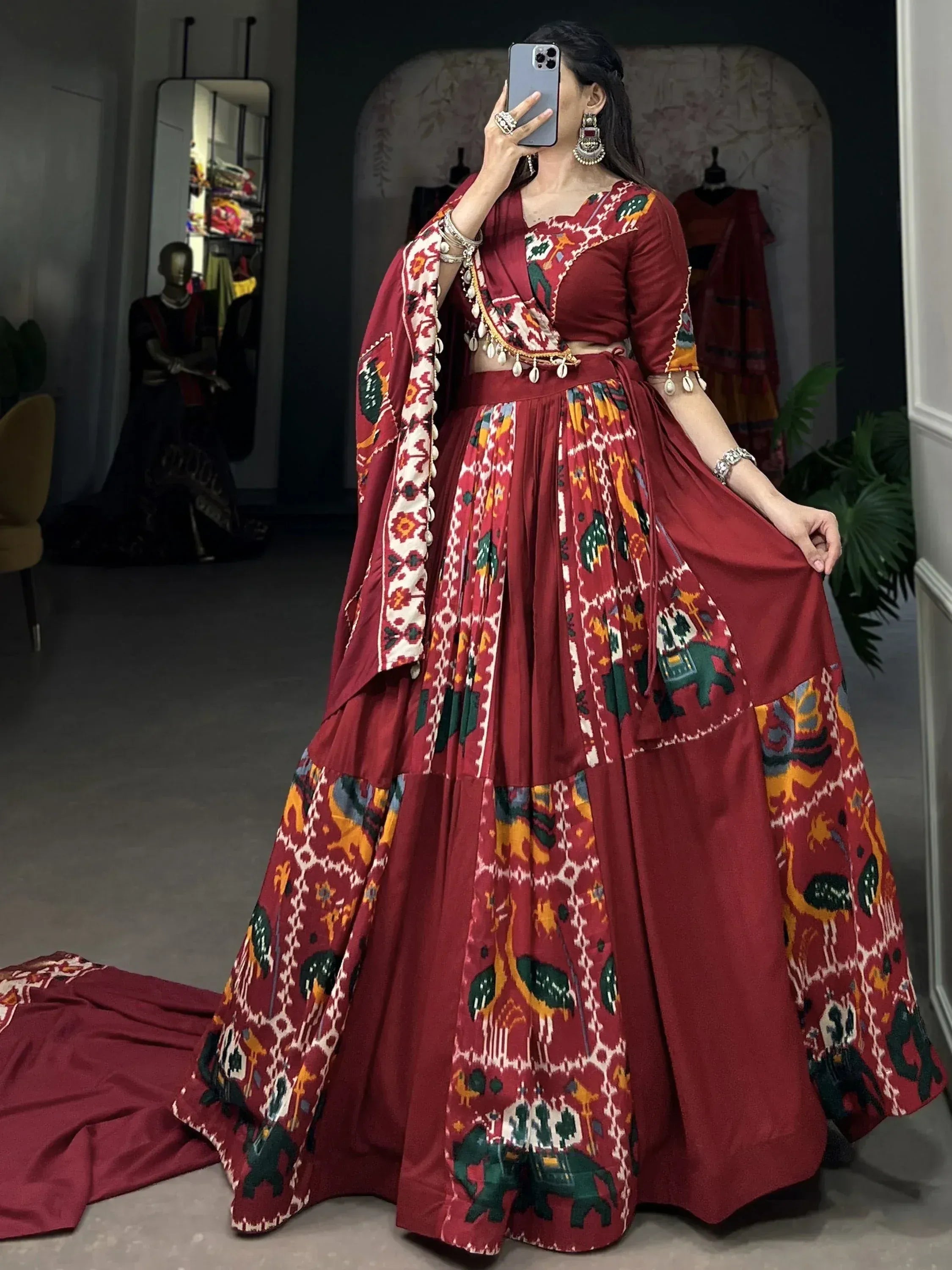 Maroon Ikat print lehenga choli with elephant motifs, perfect for Indian ethnic wear occasions