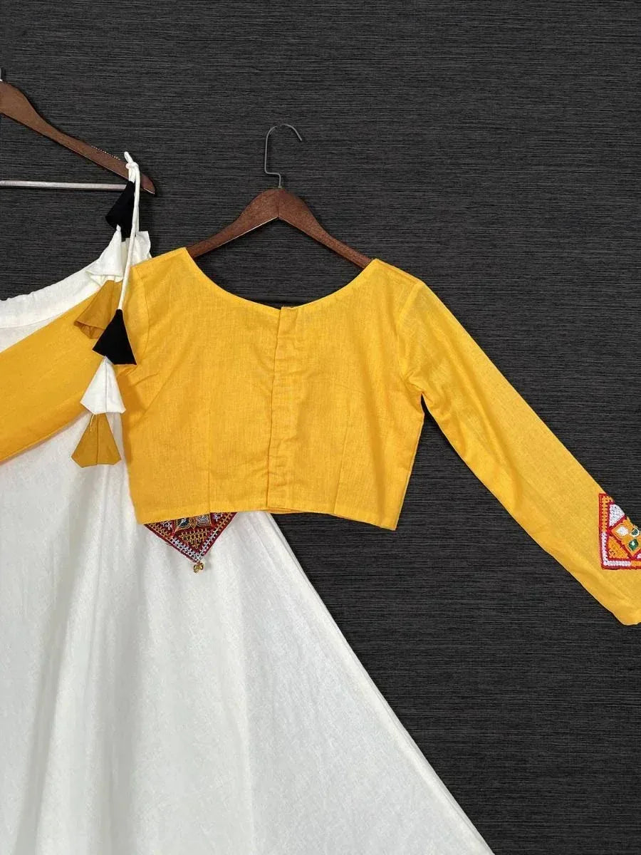 Yellow embroidered crop top with white ethnic gown, perfect for Indian festive wear