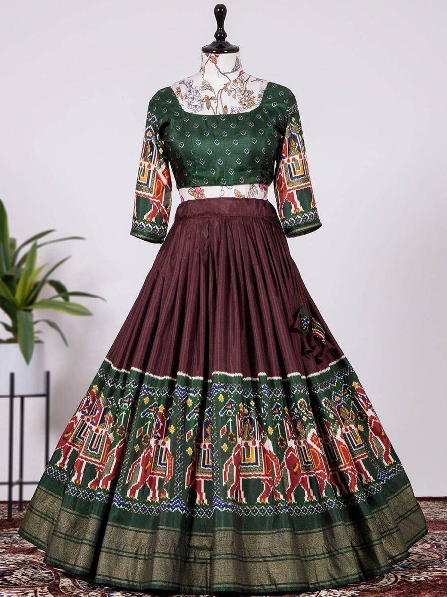 Green and maroon ethnic lehenga choli with elephant print, perfect for Indian weddings and festive occasions