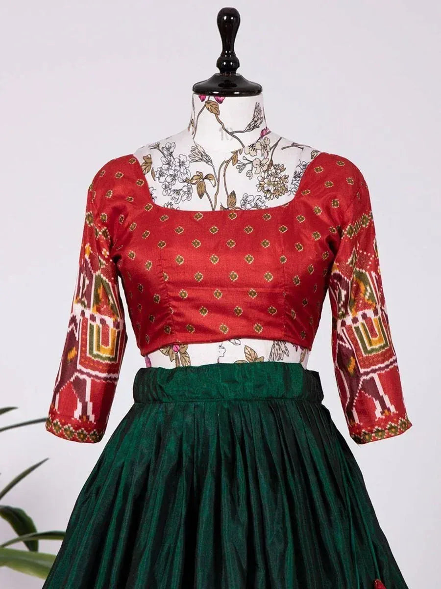Red printed blouse with green pleated skirt, ethnic Indian wear for festive occasions