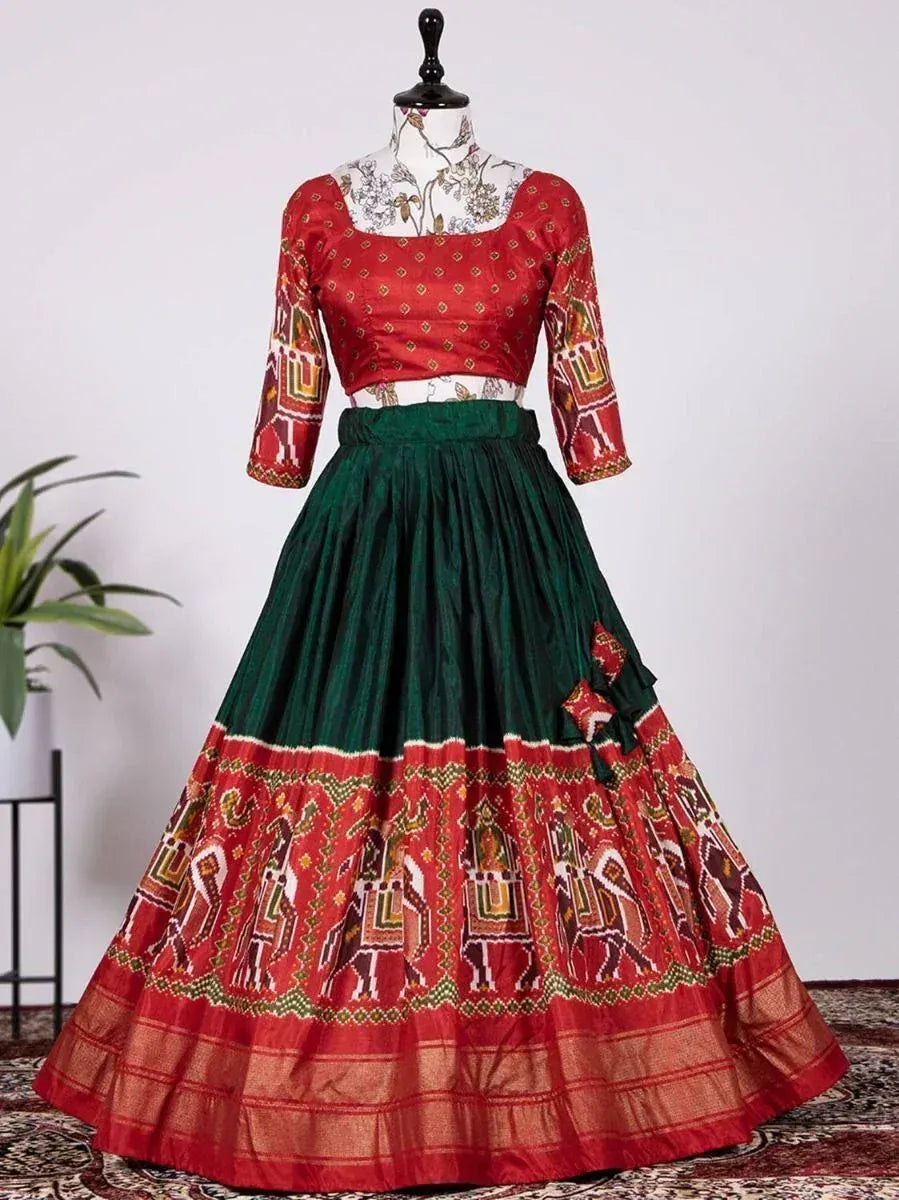 Red and green ethnic lehenga choli with elephant print, perfect for Indian weddings and festivals