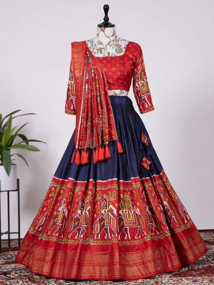 Red and navy blue ethnic lehenga choli with elephant print and tassel dupatta, perfect for Indian celebrations