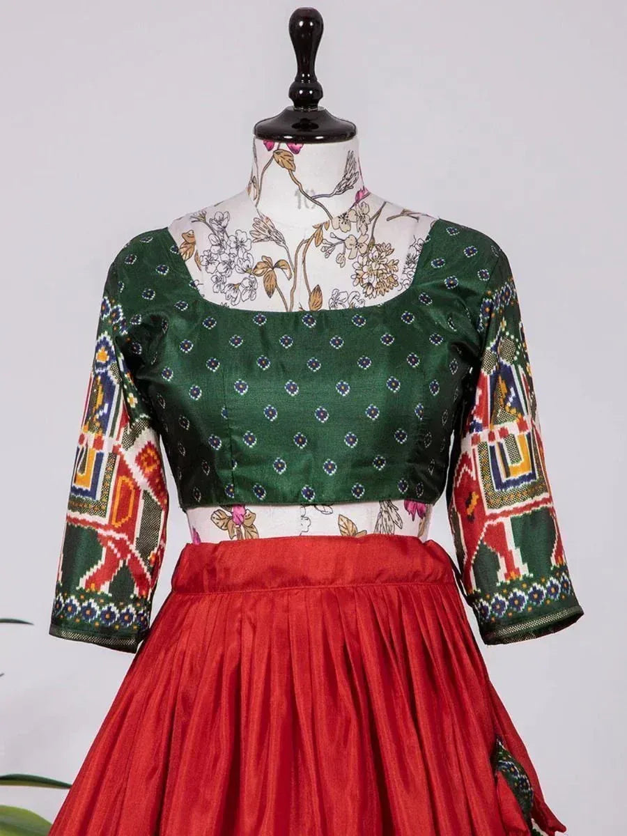 Green printed blouse with colorful sleeves paired with red pleated skirt, Indian ethnic wear
