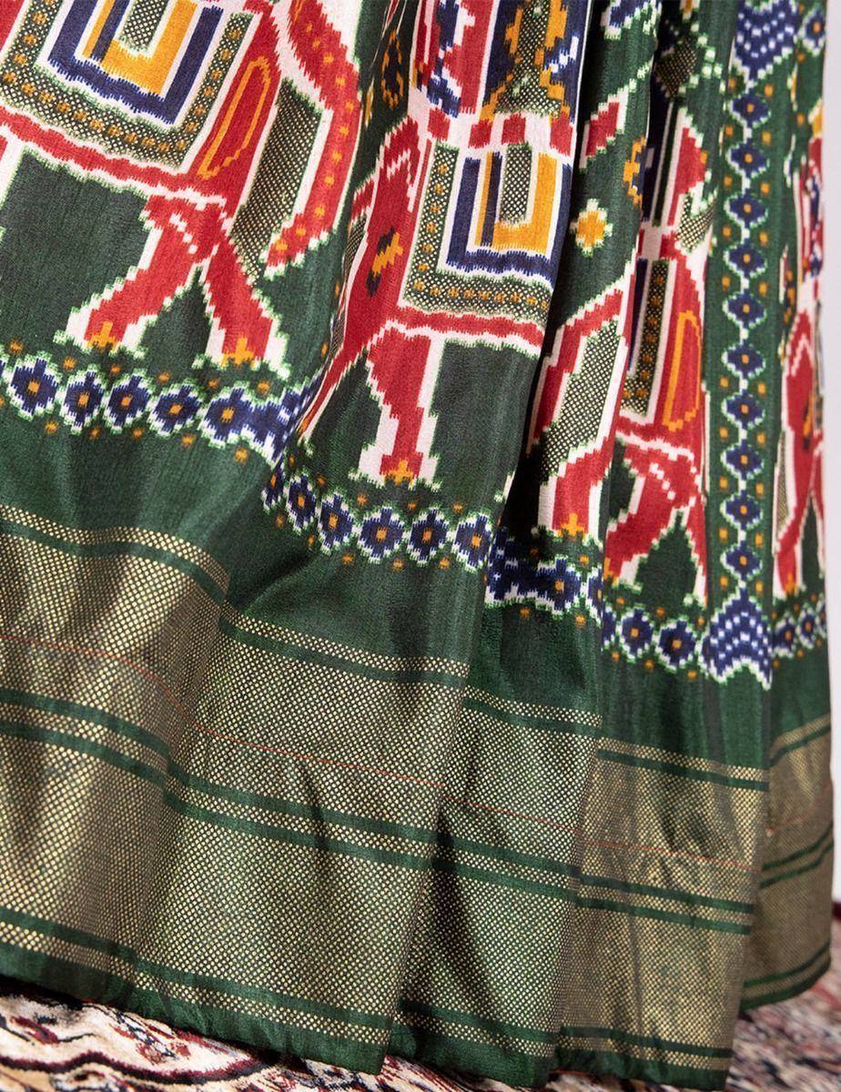 Green ethnic lehenga with vibrant geometric and elephant print, perfect for Indian festivals and weddings