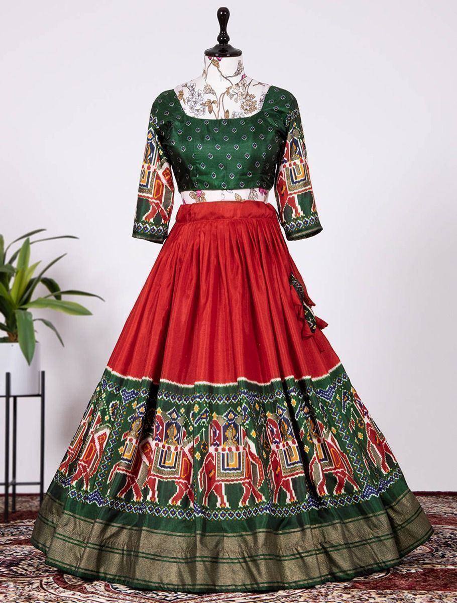 Green and red ethnic lehenga choli with elephant print, perfect for Indian weddings and festivals
