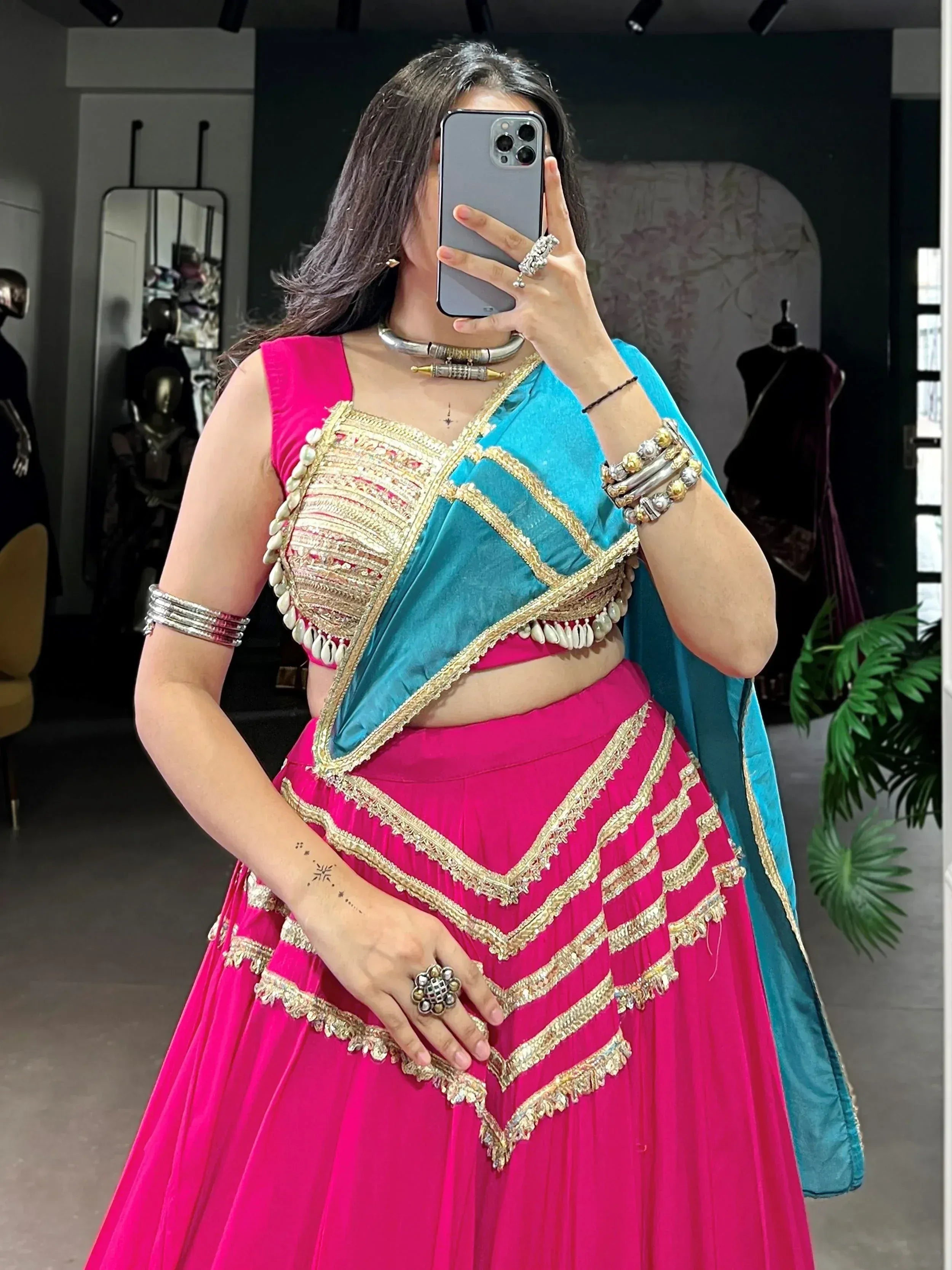 Pink and blue designer lehenga choli with gold embroidery and mirror work, perfect for Indian ethnic wear