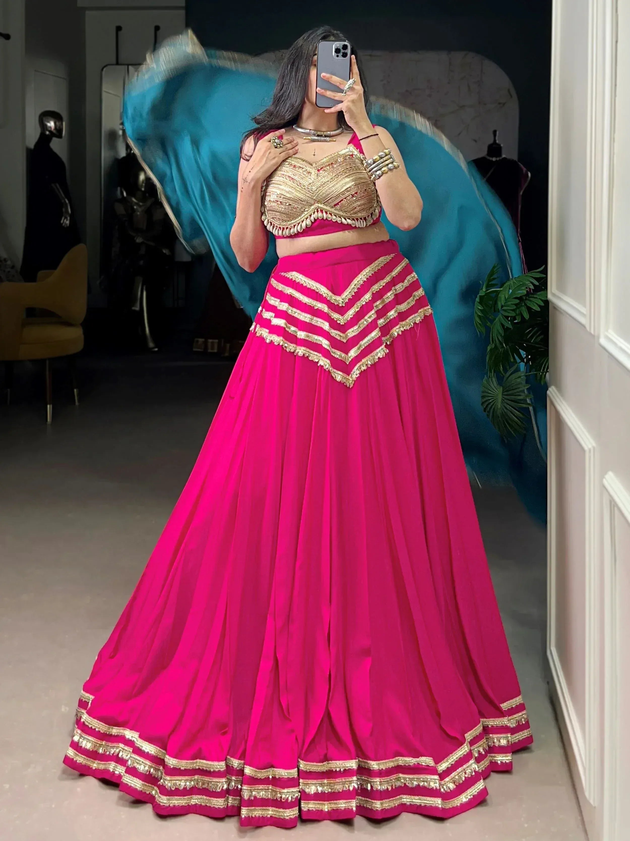 Fuchsia lehenga choli with gold embroidery, perfect for Indian ethnic wear and festive occasions.