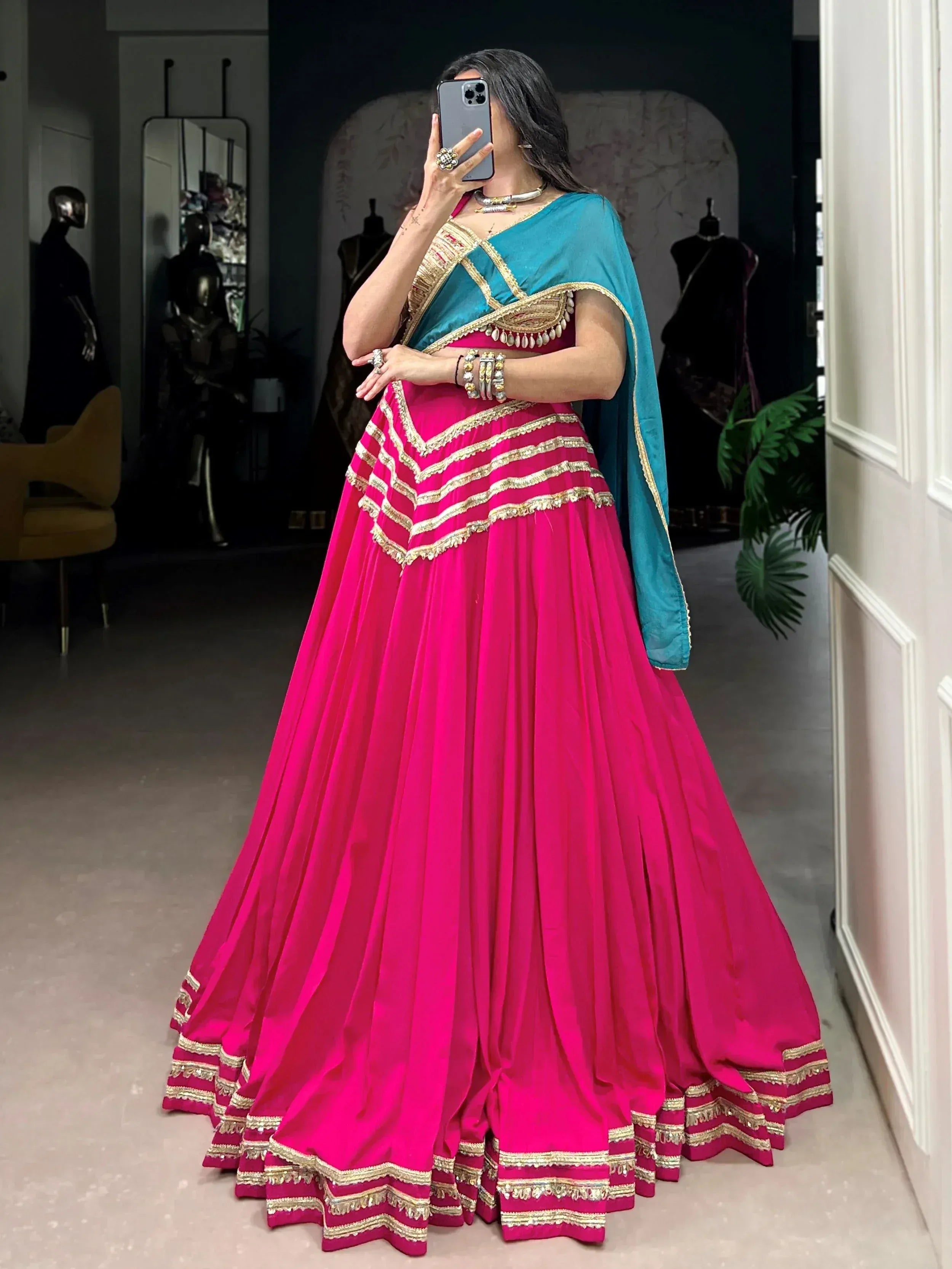Fuchsia lehenga choli with teal dupatta, gold embroidery, perfect for Indian weddings and festive occasions