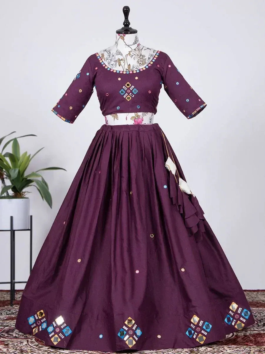 Purple ethnic gown with mirror work and floral embroidery, perfect for Indian celebrations